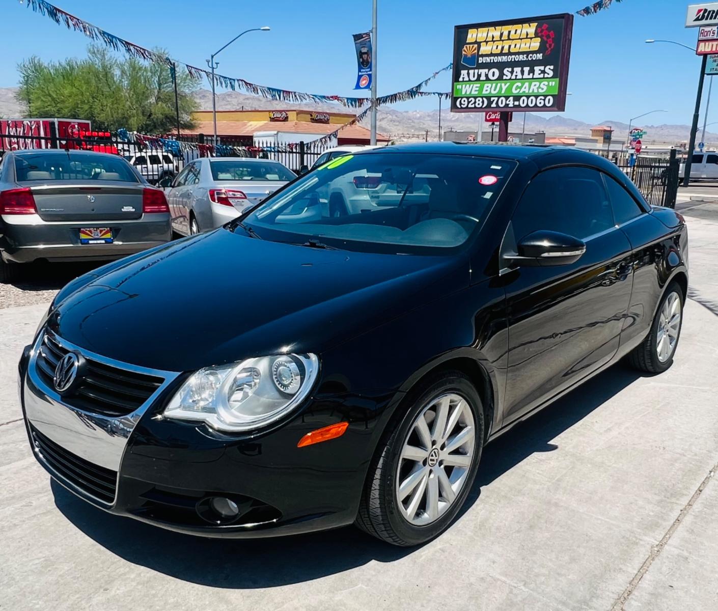 2010 Charcoal Volkswagen Eos Komfort (WVWBA7AHXAV) with an 2.0L L4 DOHC 16V engine, 6-Speed Automatic transmission, located at 2190 Hwy 95, Bullhead City, AZ, 86442, (928) 704-0060, 0.000000, 0.000000 - 2010 Volkswagen Eos. Hard top Convertible. Clean carfax. only 109k miles. Automatic, leather loaded. Financing available. - Photo #2
