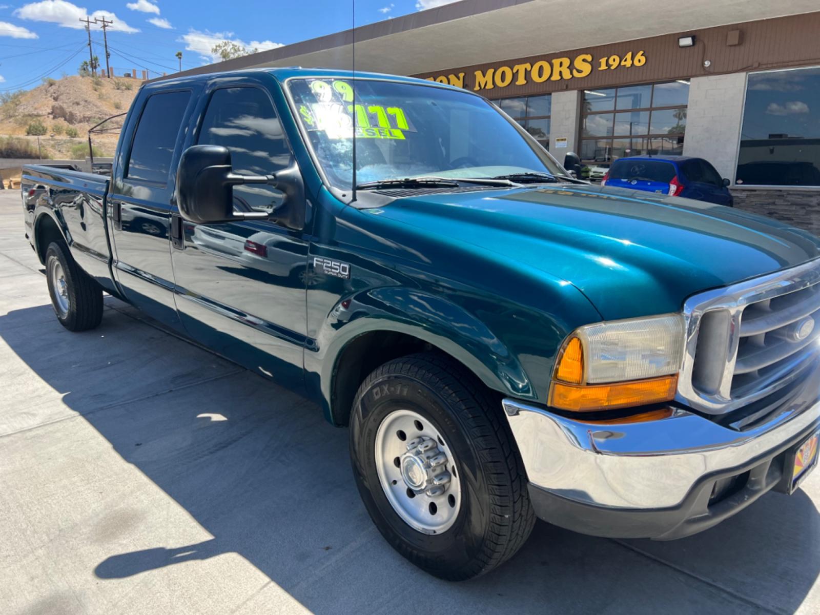 1999 Green Ford F-250 SD Lariat Crew Cab LWB 2WD (1FTNW20F4XE) with an 7.3L V8 OHV 16V TURBO DIESEL engine, located at 2190 Hwy 95, Bullhead City, AZ, 86442, (928) 704-0060, 0.000000, 0.000000 - 1999 Ford F250 crew cab long bed 7.3 powerstroke diesel. seats 6. fresh new paint. new window tint. brand new stereo with bluetooth. Completely serviced, lots of new parts. new ac system Ice cold a/c. runs and drives great. financing available. - Photo #0