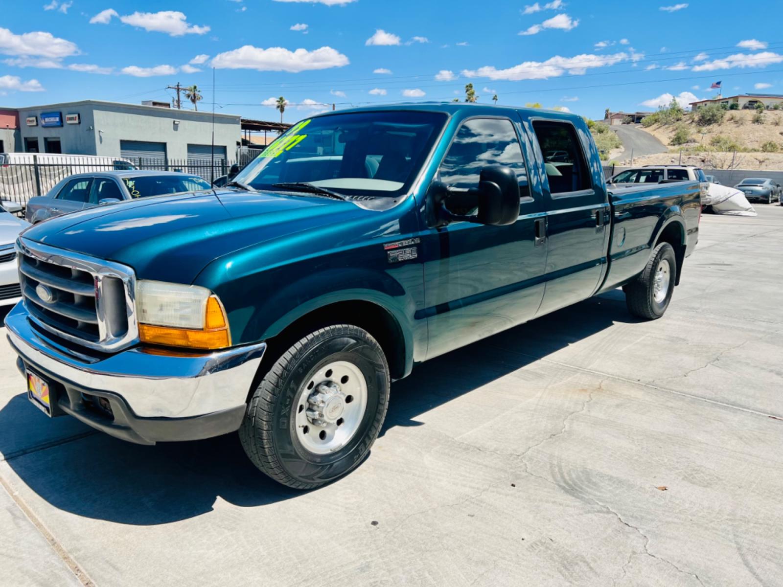 1999 Green Ford F-250 SD Lariat Crew Cab LWB 2WD (1FTNW20F4XE) with an 7.3L V8 OHV 16V TURBO DIESEL engine, located at 2190 Hwy 95, Bullhead City, AZ, 86442, (928) 704-0060, 0.000000, 0.000000 - 1999 Ford F250 crew cab long bed 7.3 powerstroke diesel. seats 6. fresh new paint. new window tint. brand new stereo with bluetooth. Completely serviced, lots of new parts. new ac system Ice cold a/c. runs and drives great. financing available. - Photo #9