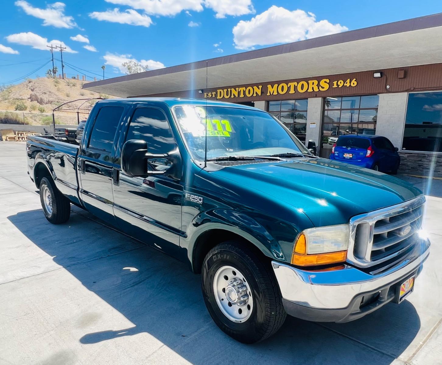 1999 Green Ford F-250 SD Lariat Crew Cab LWB 2WD (1FTNW20F4XE) with an 7.3L V8 OHV 16V TURBO DIESEL engine, located at 2190 Hwy 95, Bullhead City, AZ, 86442, (928) 704-0060, 0.000000, 0.000000 - 1999 Ford F250 crew cab long bed 7.3 powerstroke diesel. seats 6. fresh new paint. new window tint. brand new stereo with bluetooth. Completely serviced, lots of new parts. new ac system Ice cold a/c. runs and drives great. financing available. - Photo #1