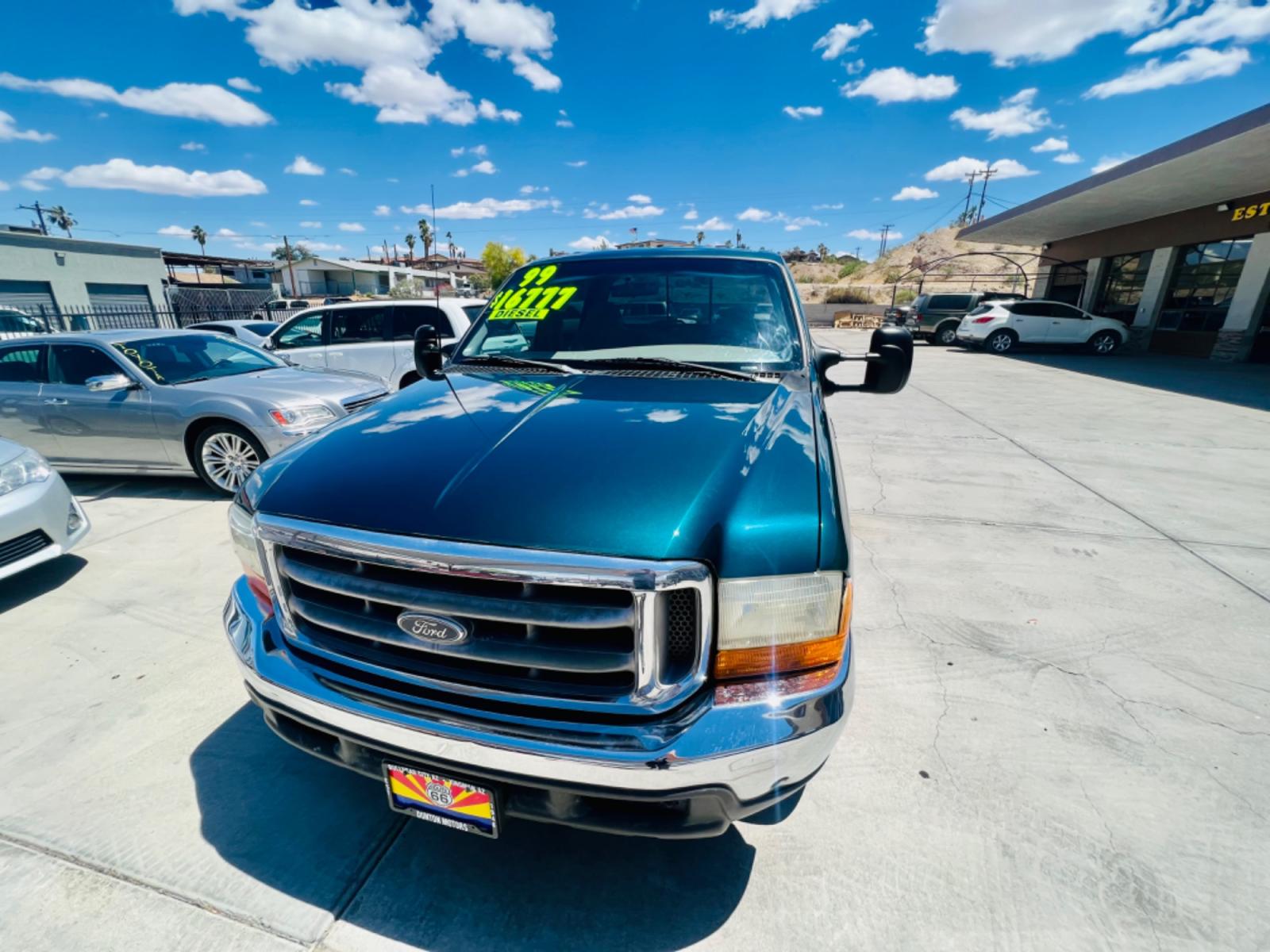 1999 Green Ford F-250 SD Lariat Crew Cab LWB 2WD (1FTNW20F4XE) with an 7.3L V8 OHV 16V TURBO DIESEL engine, located at 2190 Hwy 95, Bullhead City, AZ, 86442, (928) 704-0060, 0.000000, 0.000000 - 1999 Ford F250 crew cab long bed 7.3 powerstroke diesel. seats 6. fresh new paint. new window tint. brand new stereo with bluetooth. Completely serviced, lots of new parts. new ac system Ice cold a/c. runs and drives great. financing available. - Photo #2