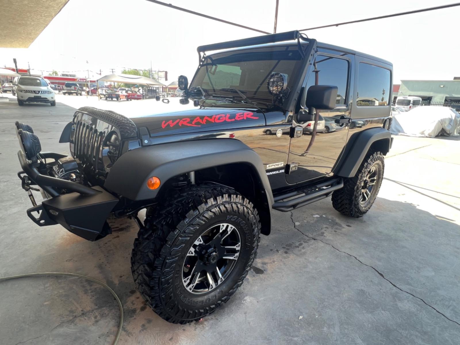2010 Black Jeep Wrangler Sport 4WD (1J4AA2D18AL) with an 3.8L V6 OHV 12V engine, located at 2190 Hwy 95, Bullhead City, AZ, 86442, (928) 704-0060, 0.000000, 0.000000 - 2010 Jeep Wrangler sport .6 speed manual . 4x4 . Hard top . Cold ac . Lift kit custom tires wheels light bars winch . Custom steel bumpers . Lots of extras for the off road . Winch . Extra lights - Photo #0