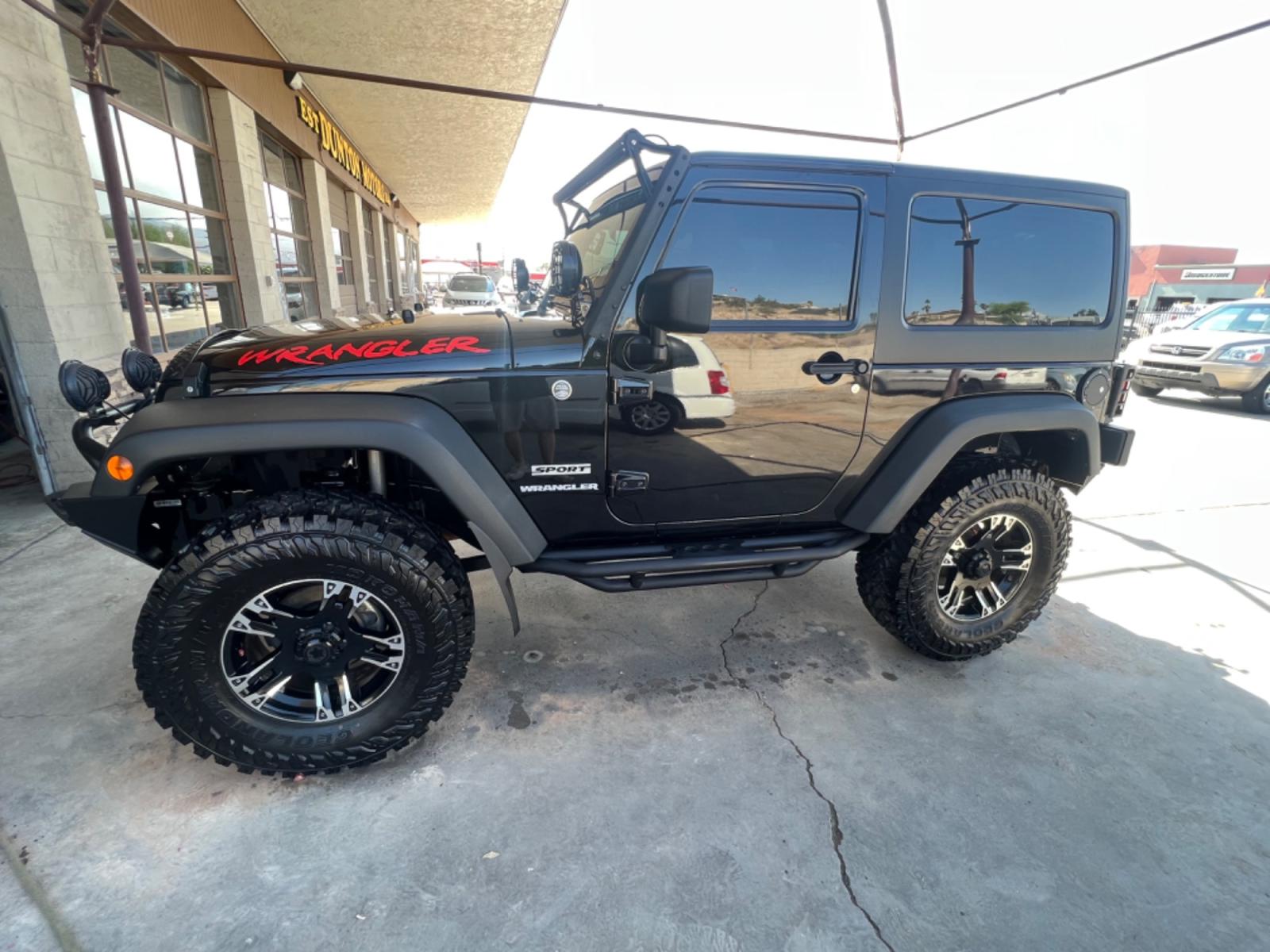 2010 Black Jeep Wrangler Sport 4WD (1J4AA2D18AL) with an 3.8L V6 OHV 12V engine, located at 2190 Hwy 95, Bullhead City, AZ, 86442, (928) 704-0060, 0.000000, 0.000000 - 2010 Jeep Wrangler sport .6 speed manual . 4x4 . Hard top . Cold ac . Lift kit custom tires wheels light bars winch . Custom steel bumpers . Lots of extras for the off road . Winch . Extra lights - Photo #1