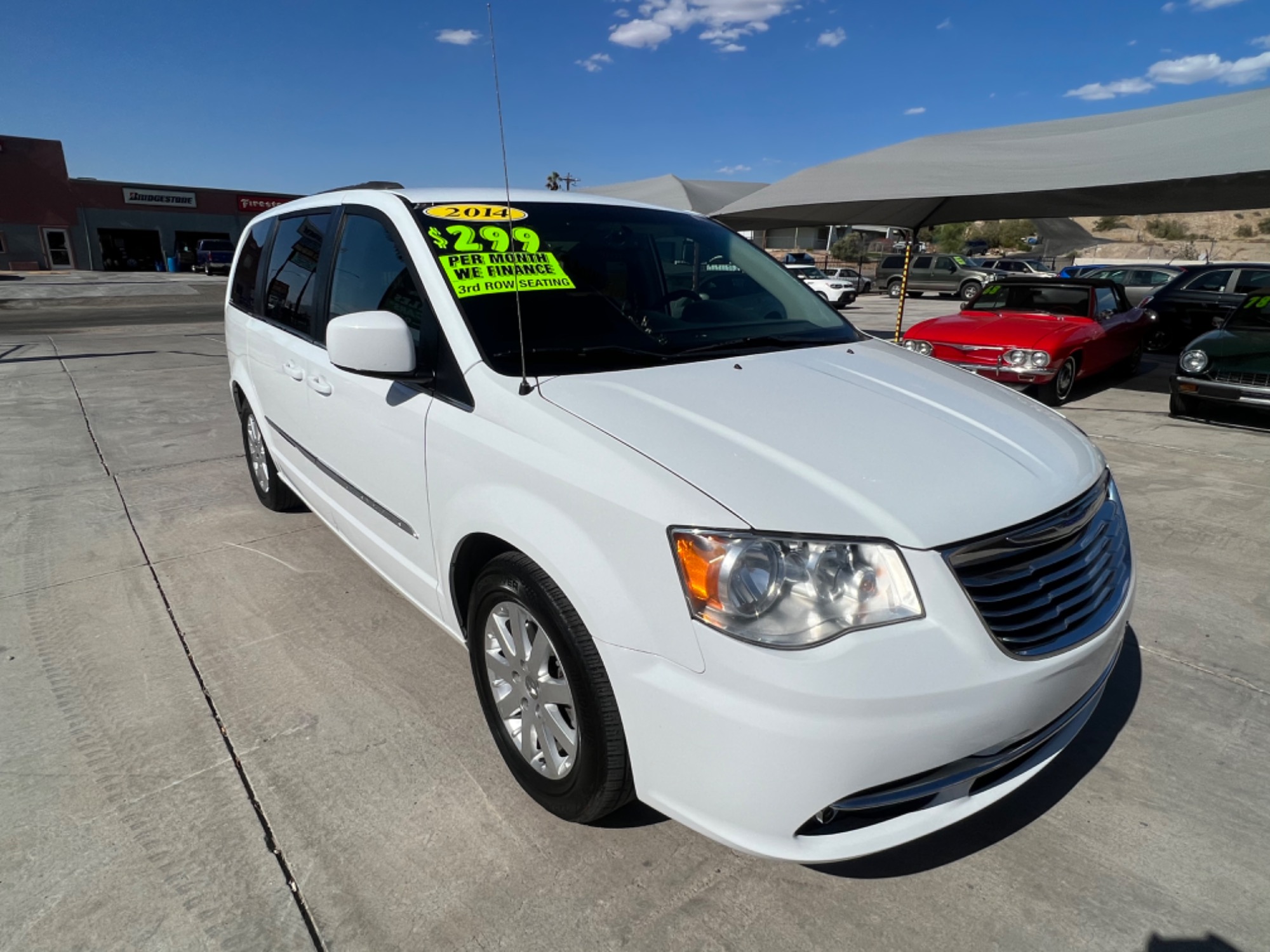 photo of 2014 Chrysler Town and Country touring. seats 7 , leather, power doors. tv dvd. rear ac. we finance !!!!!
