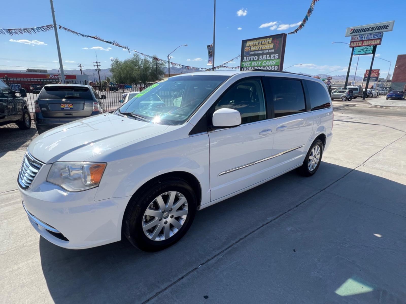 2014 White Chrysler Town and Country , located at 2190 Hwy 95, Bullhead City, AZ, 86442, (928) 704-0060, 0.000000, 0.000000 - 2014 Chryslter Town and Country Touring. Completely serviced. Runs and drives great. Free warranty. Free carfax. seats 7. bluetooth, backup camera, leather interior. fully loaded. power electric doors. keyless entry. stow and go seating v6 engine. This van has it all. IN house financing available. - Photo #1