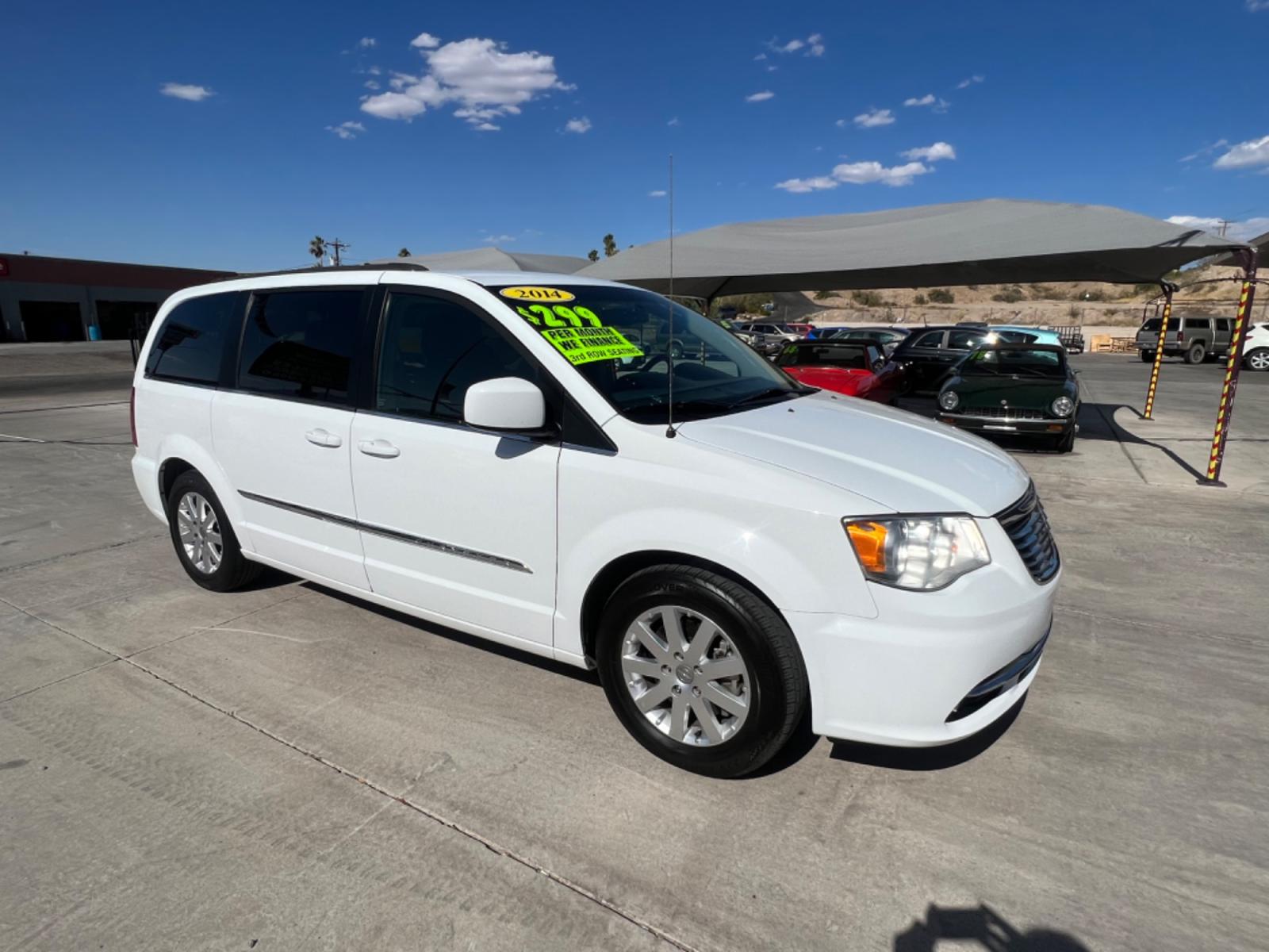 2014 White Chrysler Town and Country , located at 2190 Hwy 95, Bullhead City, AZ, 86442, (928) 704-0060, 0.000000, 0.000000 - 2014 Chryslter Town and Country Touring. Completely serviced. Runs and drives great. Free warranty. Free carfax. seats 7. bluetooth, backup camera, leather interior. fully loaded. power electric doors. keyless entry. stow and go seating v6 engine. This van has it all. IN house financing available. - Photo #3