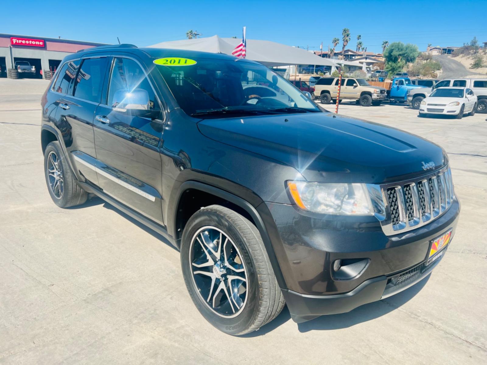 2011 Black Jeep Grand Cherokee Overland 4WD (1J4RR6GT8BC) with an 5.7L V8 OHV 16V engine, 5-Speed Automatic transmission, located at 2190 Hwy 95, Bullhead City, AZ, 86442, (928) 704-0060, 0.000000, 0.000000 - Photo #0
