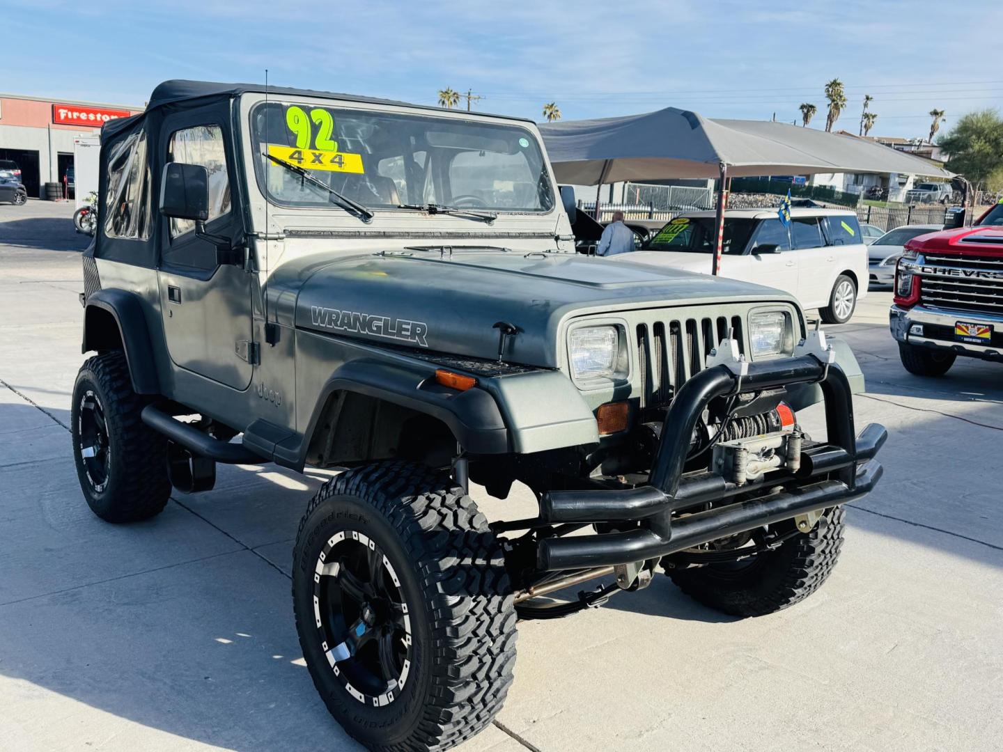 1992 green Jeep Wrangler S (2J4FY19P0NJ) with an 2.5L L4 OHV 8V engine, 5-Speed Manual Overdrive transmission, located at 2190 Hwy 95, Bullhead City, AZ, 86442, (928) 704-0060, 0.000000, 0.000000 - 1992 jeep wrangler custom. lifted custom tires/wheels. off road special. 4 cylinder manual. 4 in rough country lift kit. hit the trailer with this one. free and clear title. soft top. new hijacklift. lots of extras a must see. - Photo#0