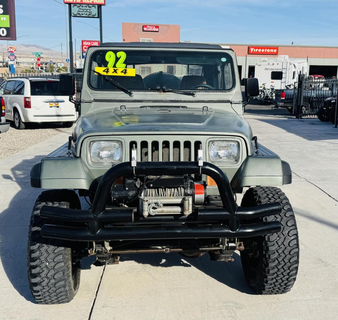 1992 green Jeep Wrangler S (2J4FY19P0NJ) with an 2.5L L4 OHV 8V engine, 5-Speed Manual Overdrive transmission, located at 2190 Hwy 95, Bullhead City, AZ, 86442, (928) 704-0060, 0.000000, 0.000000 - 1992 jeep wrangler custom. lifted custom tires/wheels. off road special. 4 cylinder manual. 4 in rough country lift kit. hit the trailer with this one. free and clear title. soft top. new hijacklift. lots of extras a must see. - Photo#3