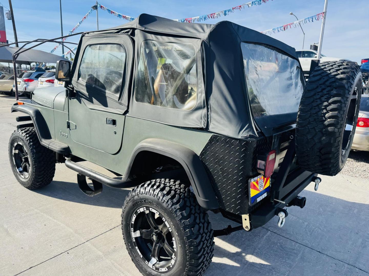 1992 green Jeep Wrangler S (2J4FY19P0NJ) with an 2.5L L4 OHV 8V engine, 5-Speed Manual Overdrive transmission, located at 2190 Hwy 95, Bullhead City, AZ, 86442, (928) 704-0060, 0.000000, 0.000000 - 1992 jeep wrangler custom. lifted custom tires/wheels. off road special. 4 cylinder manual. 4 in rough country lift kit. hit the trailer with this one. free and clear title. soft top. new hijacklift. lots of extras a must see. - Photo#6