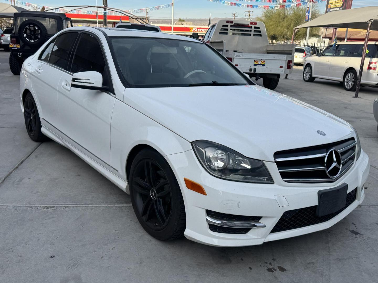 2013 White /Tan Mercedes-Benz C-Class C250 Sport Sedan (WDDGF4HBXDR) with an 3.0L V6 DOHC 16V engine, 7-Speed Automatic transmission, located at 2190 Hwy 95, Bullhead City, AZ, 86442, (928) 704-0060, 0.000000, 0.000000 - 2013 Mercedes Benz C250. Only 82k miles . Custom stereo fresh window tint . , moonroof . Backup camera . Navigation. . Free warranty . Free CARFAX . In house financing - Photo#0