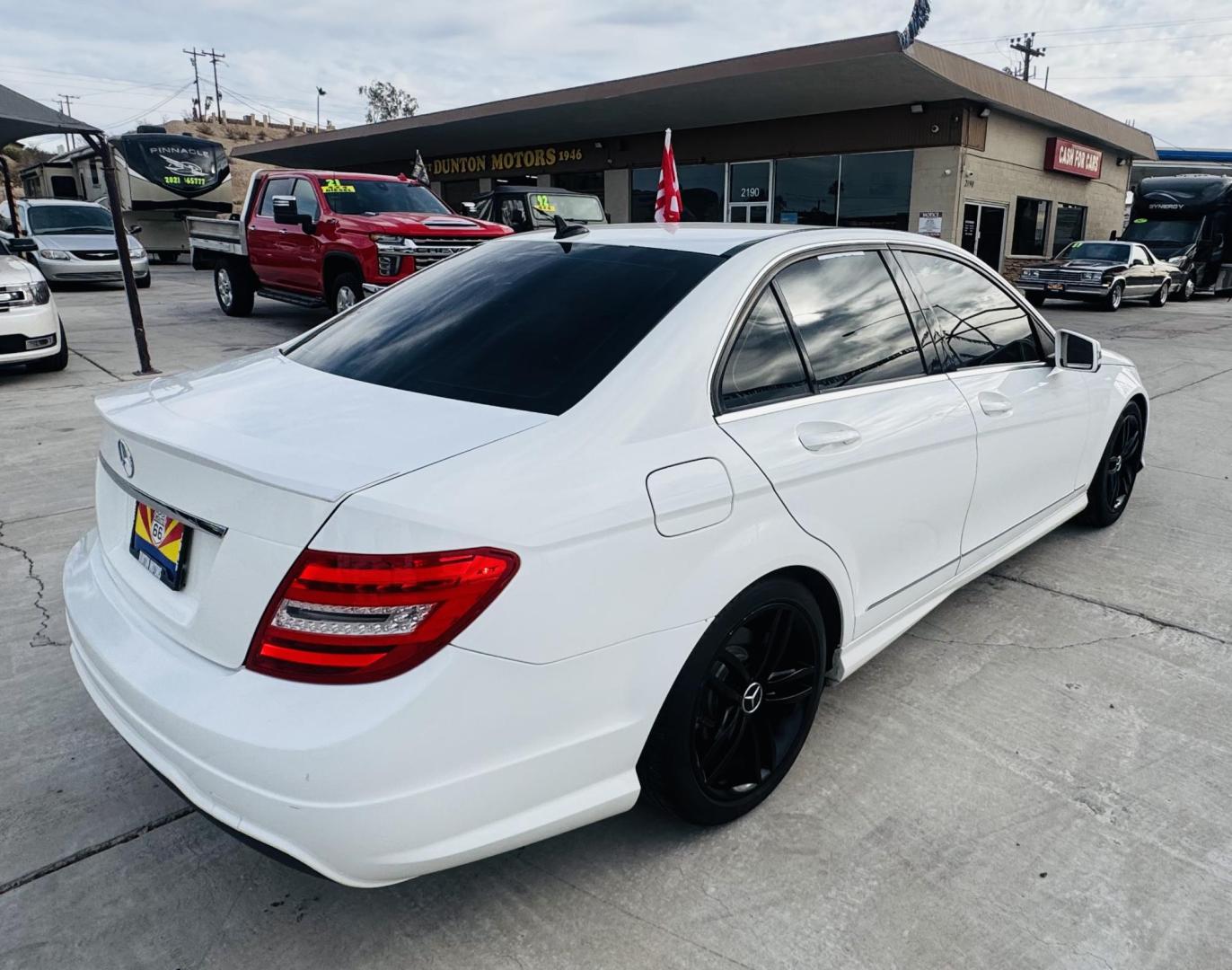 2013 White /Tan Mercedes-Benz C-Class C250 Sport Sedan (WDDGF4HBXDR) with an 3.0L V6 DOHC 16V engine, 7-Speed Automatic transmission, located at 2190 Hwy 95, Bullhead City, AZ, 86442, (928) 704-0060, 0.000000, 0.000000 - 2013 Mercedes Benz C250. Only 82k miles . Custom stereo fresh window tint . , moonroof . Backup camera . Navigation. . Free warranty . Free CARFAX . In house financing - Photo#4