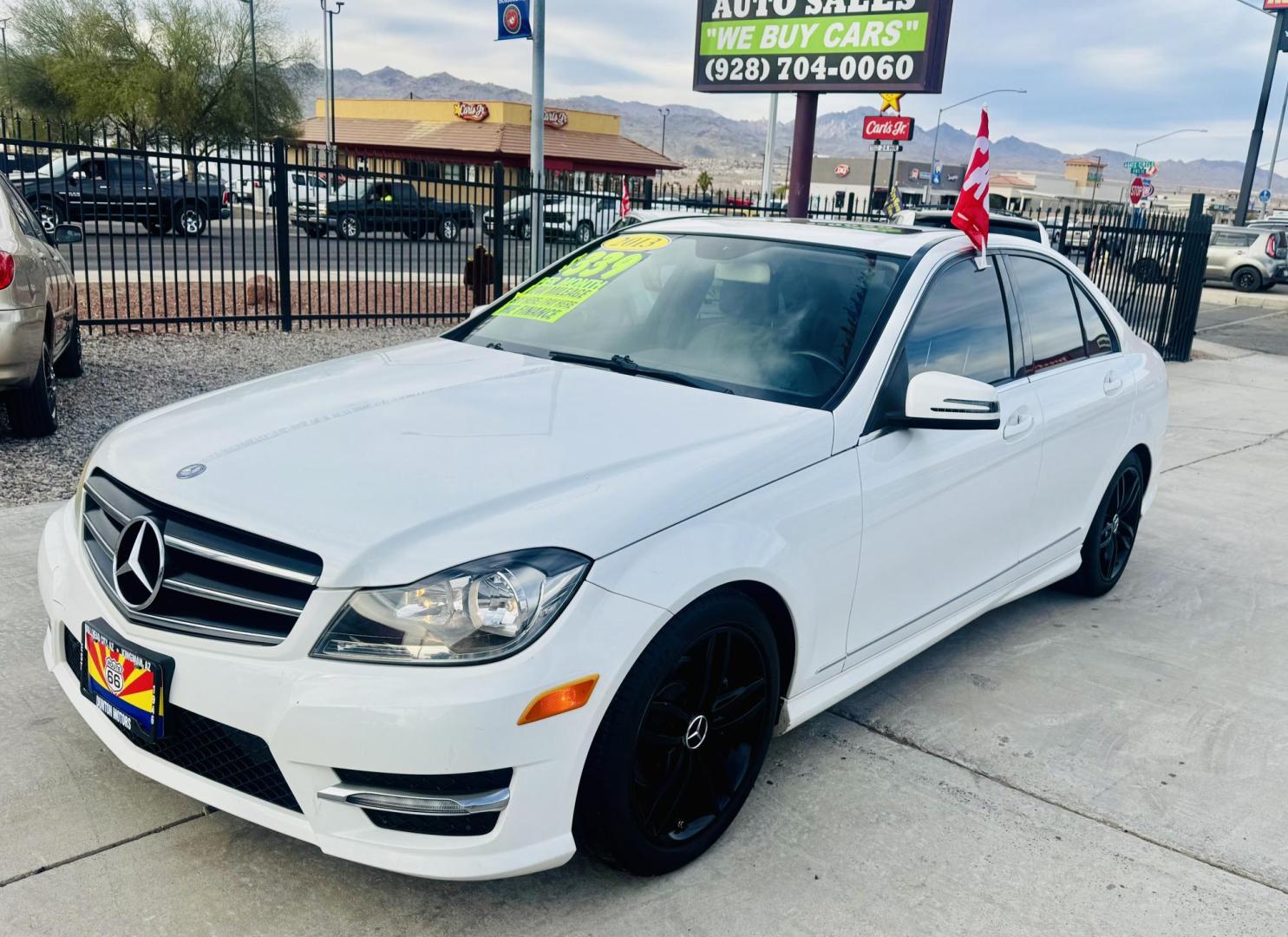 2013 White /Tan Mercedes-Benz C-Class C250 Sport Sedan (WDDGF4HBXDR) with an 3.0L V6 DOHC 16V engine, 7-Speed Automatic transmission, located at 2190 Hwy 95, Bullhead City, AZ, 86442, (928) 704-0060, 0.000000, 0.000000 - 2013 Mercedes Benz C250. Only 82k miles . Custom stereo fresh window tint . , moonroof . Backup camera . Navigation. . Free warranty . Free CARFAX . In house financing - Photo#3