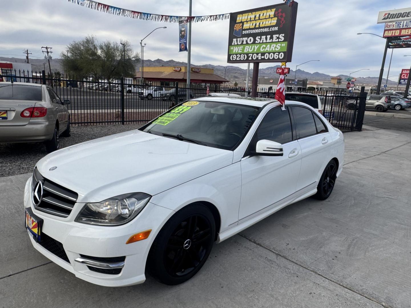 2013 White /Tan Mercedes-Benz C-Class C250 Sport Sedan (WDDGF4HBXDR) with an 3.0L V6 DOHC 16V engine, 7-Speed Automatic transmission, located at 2190 Hwy 95, Bullhead City, AZ, 86442, (928) 704-0060, 0.000000, 0.000000 - 2013 Mercedes Benz C250. Only 82k miles . Custom stereo fresh window tint . , moonroof . Backup camera . Navigation. . Free warranty . Free CARFAX . In house financing - Photo#7