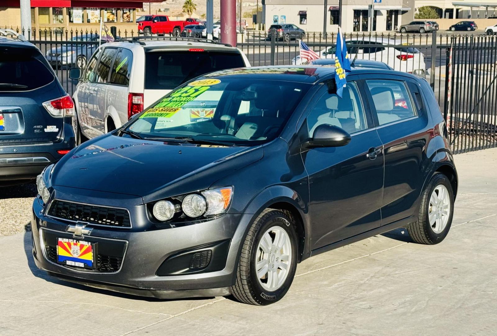 2013 grey Chevrolet Sonic LT Auto 5-Door (1G1JC6SG4D4) with an 1.8L L4 DOHC 24V engine, 6-Speed Automatic transmission, located at 2190 Hwy 95, Bullhead City, AZ, 86442, (928) 704-0060, 0.000000, 0.000000 - Photo#5