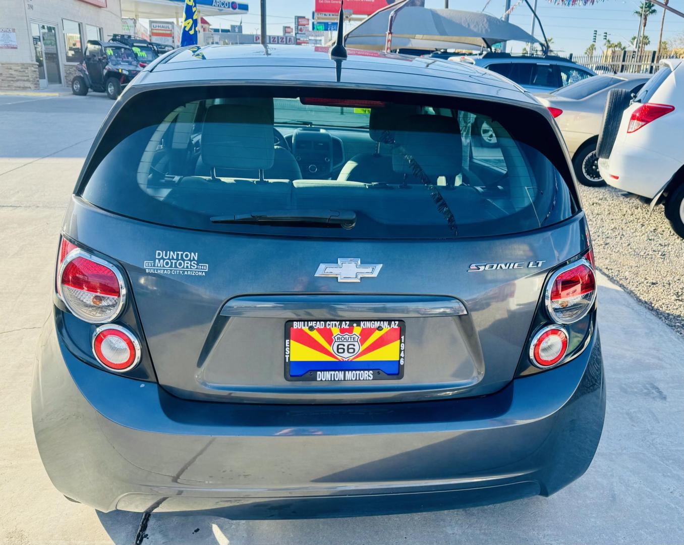 2013 grey Chevrolet Sonic LT Auto 5-Door (1G1JC6SG4D4) with an 1.8L L4 DOHC 24V engine, 6-Speed Automatic transmission, located at 2190 Hwy 95, Bullhead City, AZ, 86442, (928) 704-0060, 0.000000, 0.000000 - Photo#2