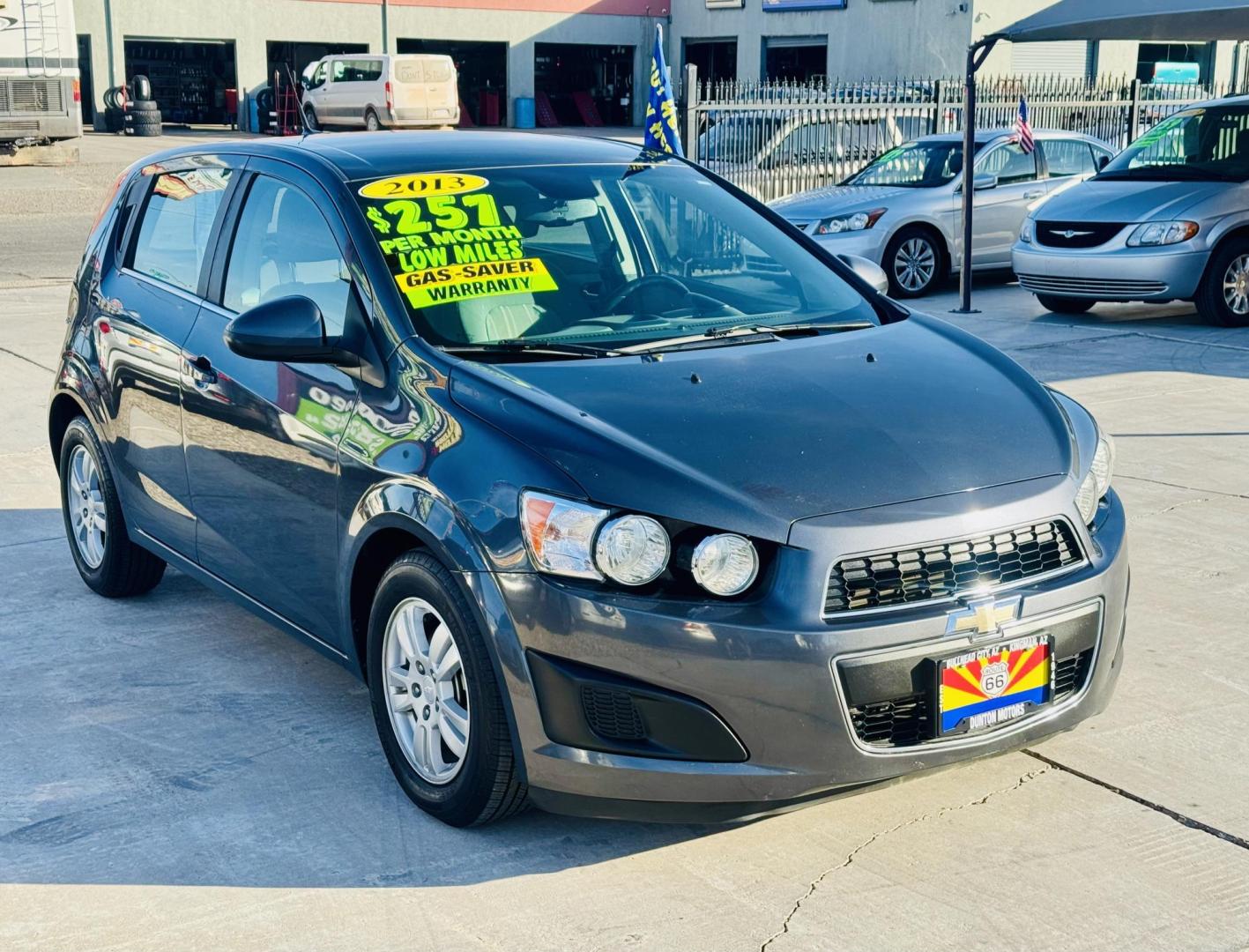 2013 grey Chevrolet Sonic LT Auto 5-Door (1G1JC6SG4D4) with an 1.8L L4 DOHC 24V engine, 6-Speed Automatic transmission, located at 2190 Hwy 95, Bullhead City, AZ, 86442, (928) 704-0060, 0.000000, 0.000000 - Photo#0