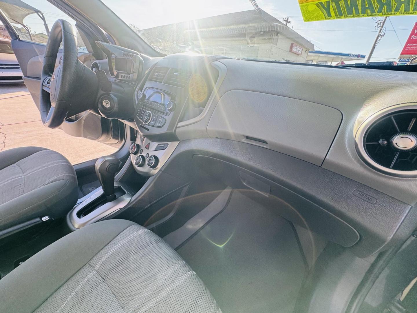 2013 grey Chevrolet Sonic LT Auto 5-Door (1G1JC6SG4D4) with an 1.8L L4 DOHC 24V engine, 6-Speed Automatic transmission, located at 2190 Hwy 95, Bullhead City, AZ, 86442, (928) 704-0060, 0.000000, 0.000000 - Photo#8