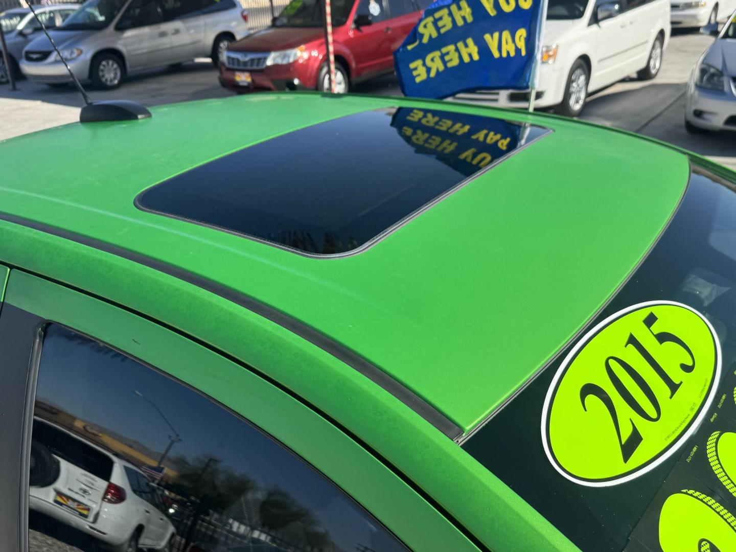 2015 Lime Green Chevrolet Sonic LT Auto Sedan (1G1JC5SB0F4) with an 1.4L L4 DOHC 24V TURBO engine, 6-Speed Automatic transmission, located at 2190 Hwy 95, Bullhead City, AZ, 86442, (928) 704-0060, 0.000000, 0.000000 - 1 owner. custom tires/ wheels. rare lime green color. we finance - Photo#2