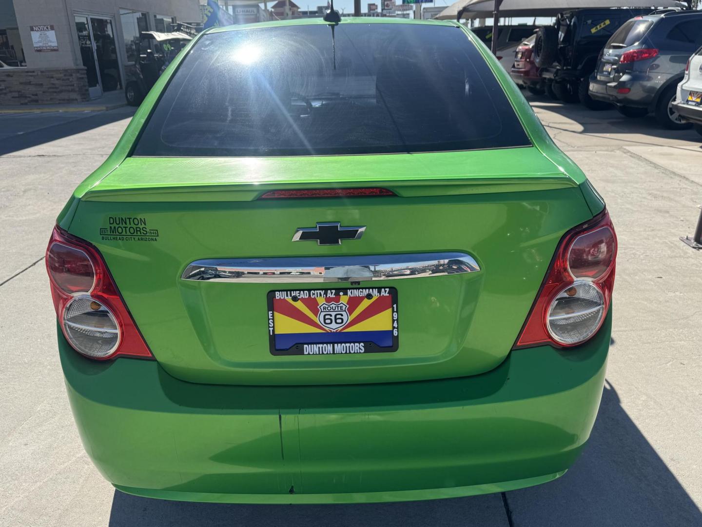 2015 Lime Green Chevrolet Sonic LT Auto Sedan (1G1JC5SB0F4) with an 1.4L L4 DOHC 24V TURBO engine, 6-Speed Automatic transmission, located at 2190 Hwy 95, Bullhead City, AZ, 86442, (928) 704-0060, 0.000000, 0.000000 - 1 owner. custom tires/ wheels. rare lime green color. we finance - Photo#3