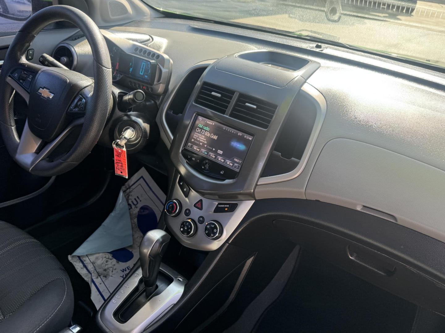 2015 Lime Green Chevrolet Sonic LT Auto Sedan (1G1JC5SB0F4) with an 1.4L L4 DOHC 24V TURBO engine, 6-Speed Automatic transmission, located at 2190 Hwy 95, Bullhead City, AZ, 86442, (928) 704-0060, 0.000000, 0.000000 - 1 owner. custom tires/ wheels. rare lime green color. we finance - Photo#8