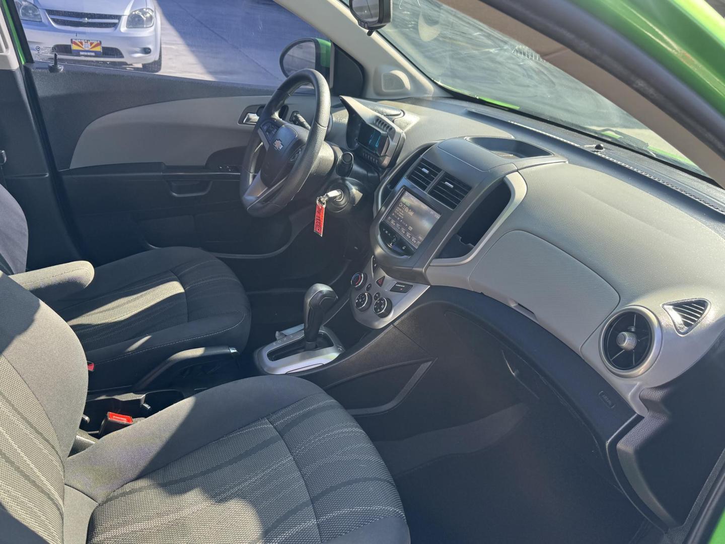 2015 Lime Green Chevrolet Sonic LT Auto Sedan (1G1JC5SB0F4) with an 1.4L L4 DOHC 24V TURBO engine, 6-Speed Automatic transmission, located at 2190 Hwy 95, Bullhead City, AZ, 86442, (928) 704-0060, 0.000000, 0.000000 - 1 owner. custom tires/ wheels. rare lime green color. we finance - Photo#9