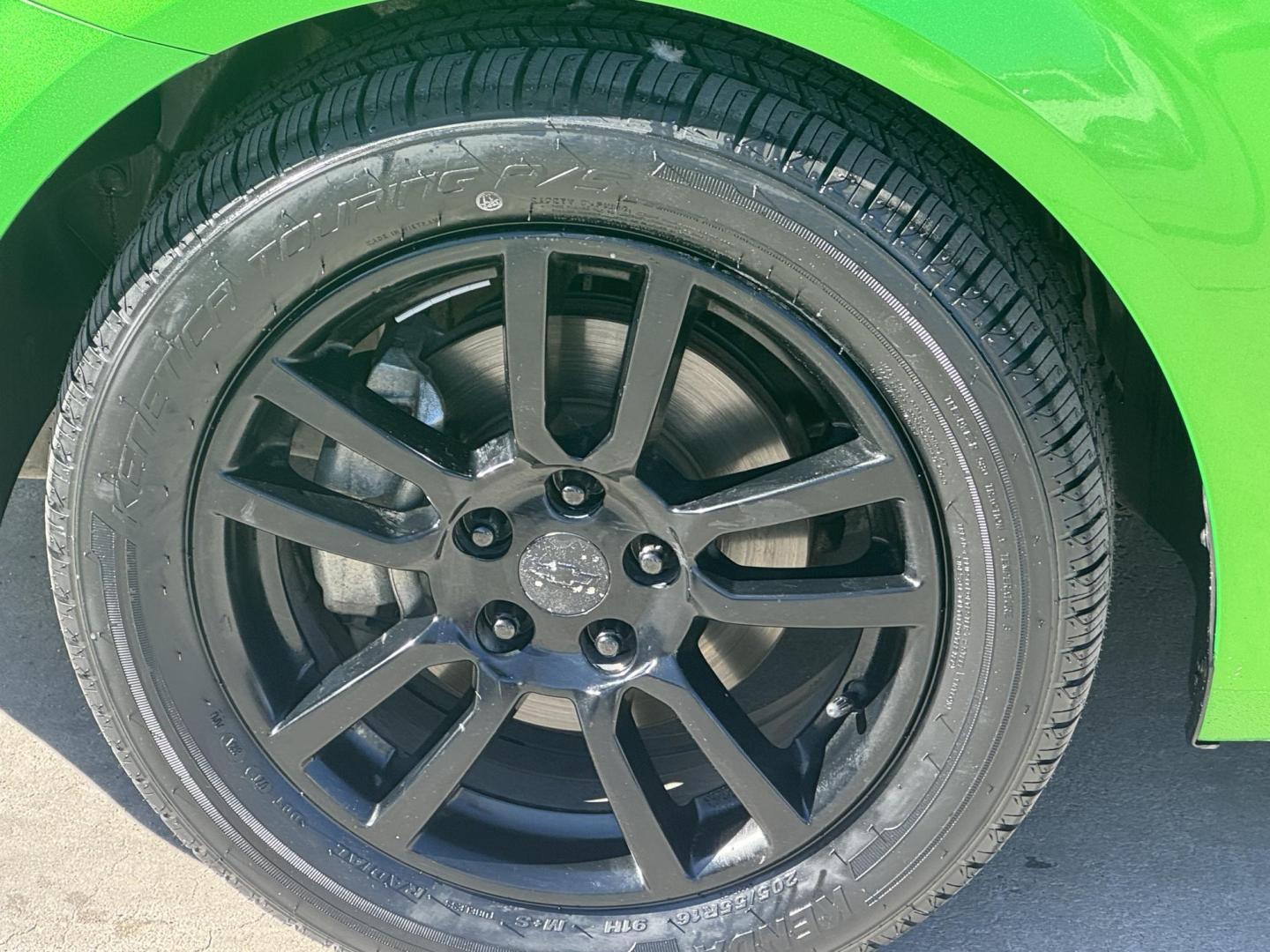 2015 Lime Green Chevrolet Sonic LT Auto Sedan (1G1JC5SB0F4) with an 1.4L L4 DOHC 24V TURBO engine, 6-Speed Automatic transmission, located at 2190 Hwy 95, Bullhead City, AZ, 86442, (928) 704-0060, 0.000000, 0.000000 - 1 owner. custom tires/ wheels. rare lime green color. we finance - Photo#6