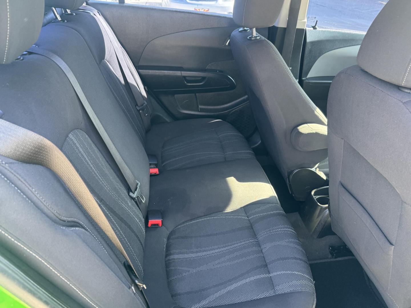 2015 Lime Green Chevrolet Sonic LT Auto Sedan (1G1JC5SB0F4) with an 1.4L L4 DOHC 24V TURBO engine, 6-Speed Automatic transmission, located at 2190 Hwy 95, Bullhead City, AZ, 86442, (928) 704-0060, 0.000000, 0.000000 - 1 owner. custom tires/ wheels. rare lime green color. we finance - Photo#7