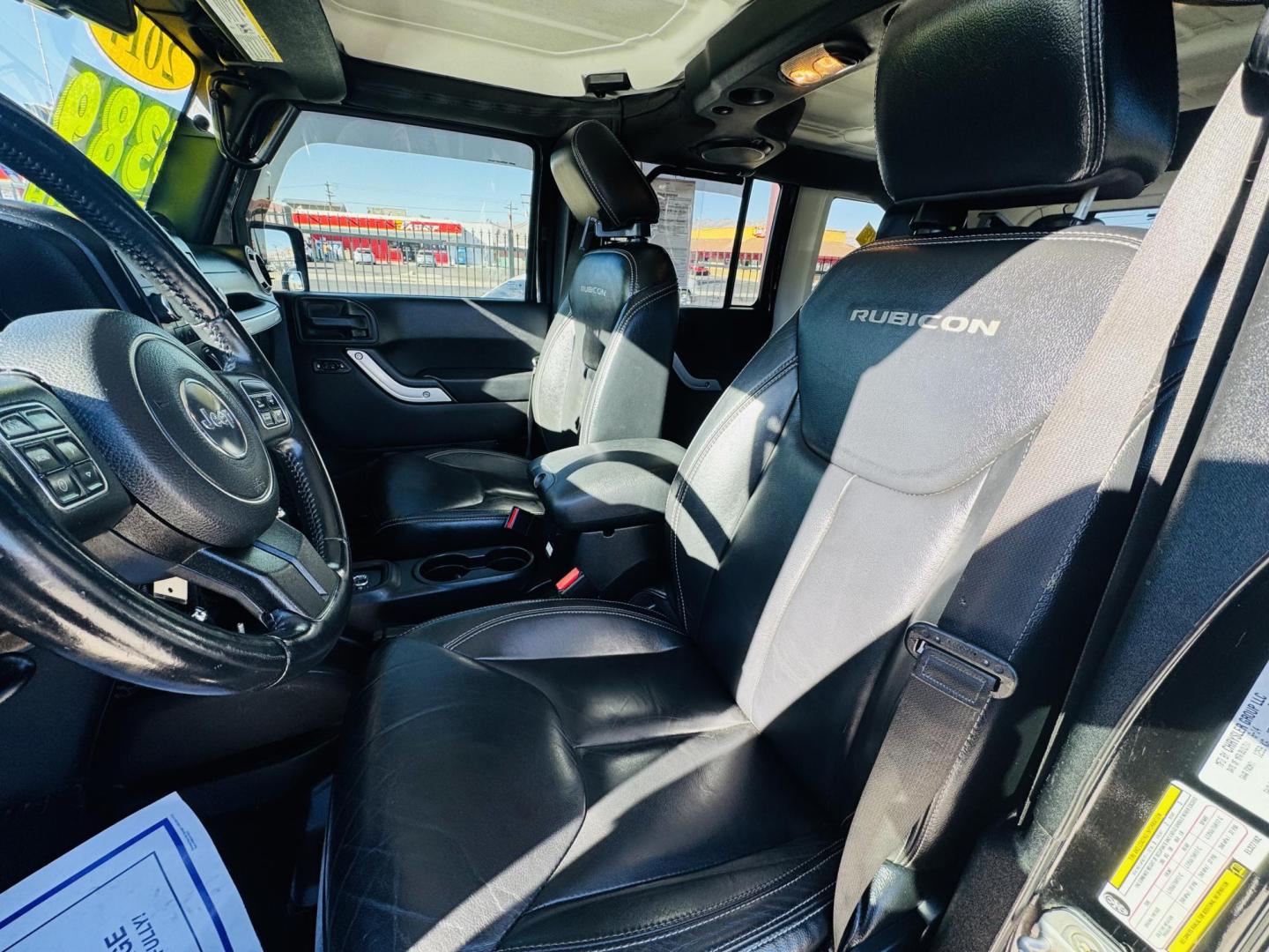 2014 Black Jeep Wrangler Unlimited Rubicon 4WD (1C4BJWFG0EL) with an 3.6L V6 DOHC 24V FFV engine, located at 2190 Hwy 95, Bullhead City, AZ, 86442, (928) 704-0060, 0.000000, 0.000000 - 2014 Jeep wrangler Rubicon. Automatic 4x4. hard top. carbon custom hood. 4 in lift kit with 33 in tires. Lots of extras, full size spare, on board compressor. satellite radio, leather, navigation. Top of the line for jeeps. v6. 110k miles. In excellent shape. free and clear title. Financing availabl - Photo#16