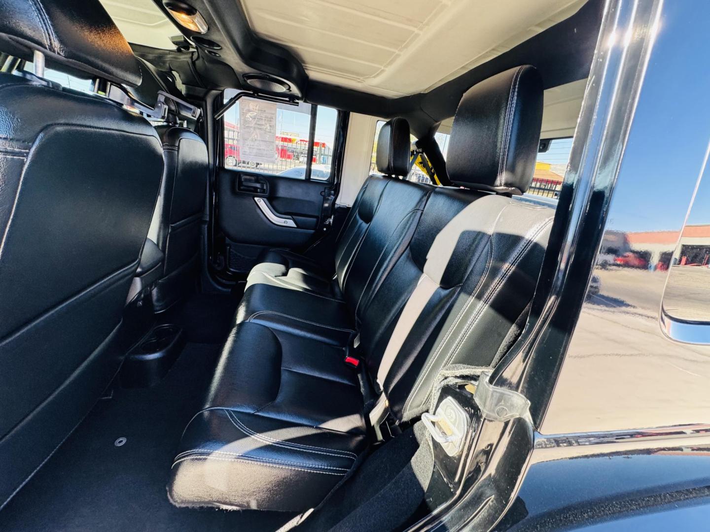 2014 Black Jeep Wrangler Unlimited Rubicon 4WD (1C4BJWFG0EL) with an 3.6L V6 DOHC 24V FFV engine, located at 2190 Hwy 95, Bullhead City, AZ, 86442, (928) 704-0060, 0.000000, 0.000000 - 2014 Jeep wrangler Rubicon. Automatic 4x4. hard top. carbon custom hood. 4 in lift kit with 33 in tires. Lots of extras, full size spare, on board compressor. satellite radio, leather, navigation. Top of the line for jeeps. v6. 110k miles. In excellent shape. free and clear title. Financing availabl - Photo#18