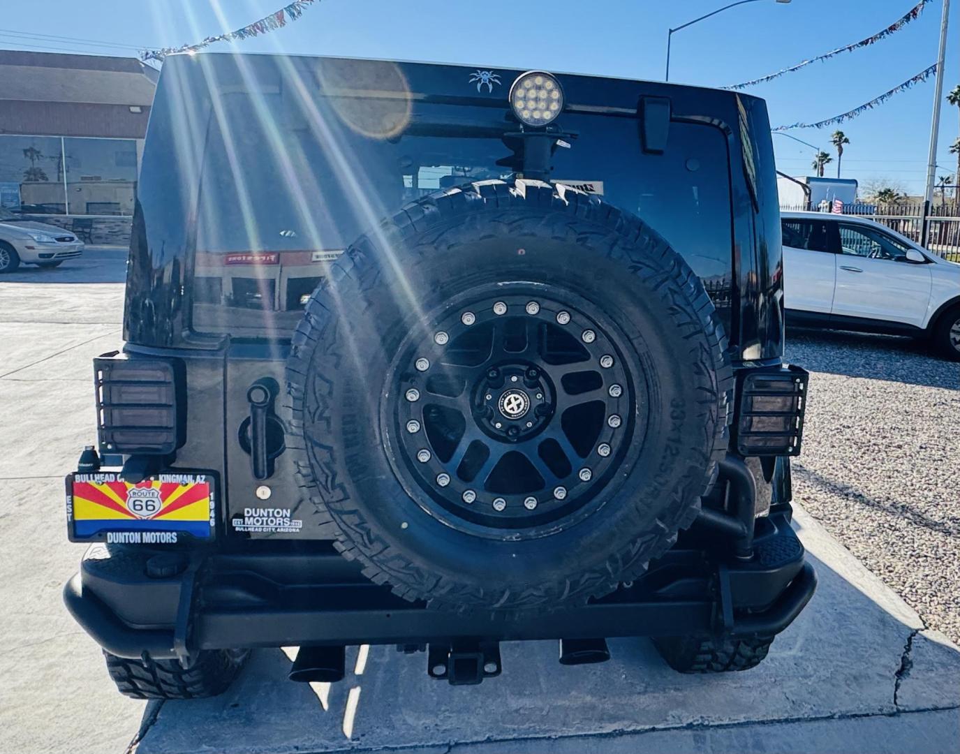 2014 Black Jeep Wrangler Unlimited Rubicon 4WD (1C4BJWFG0EL) with an 3.6L V6 DOHC 24V FFV engine, located at 2190 Hwy 95, Bullhead City, AZ, 86442, (928) 704-0060, 0.000000, 0.000000 - 2014 Jeep wrangler Rubicon. Automatic 4x4. hard top. carbon custom hood. 4 in lift kit with 33 in tires. Lots of extras, full size spare, on board compressor. satellite radio, leather, navigation. Top of the line for jeeps. v6. 110k miles. In excellent shape. free and clear title. Financing availabl - Photo#5