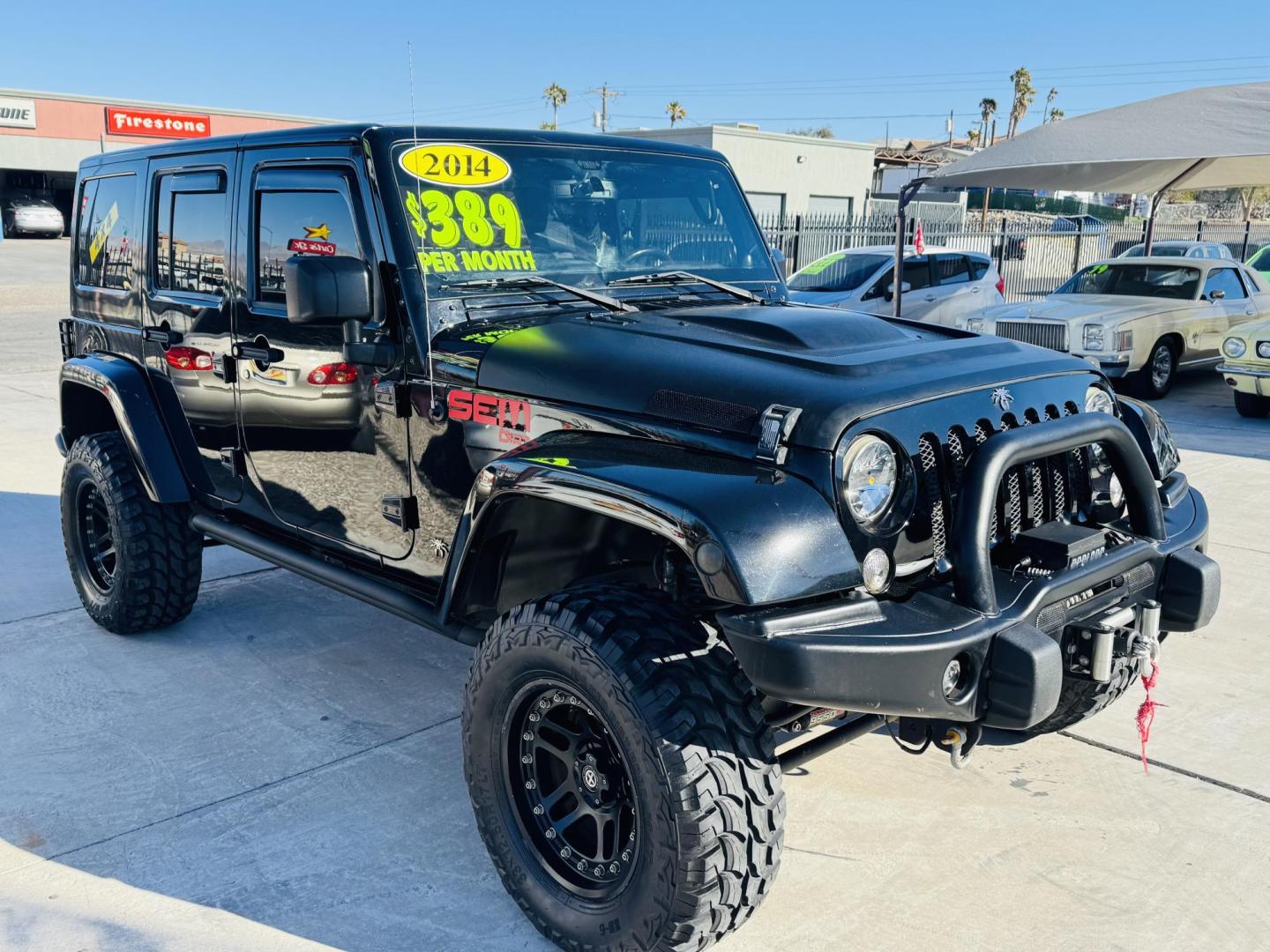 2014 Black Jeep Wrangler Unlimited Rubicon 4WD (1C4BJWFG0EL) with an 3.6L V6 DOHC 24V FFV engine, located at 2190 Hwy 95, Bullhead City, AZ, 86442, (928) 704-0060, 0.000000, 0.000000 - 2014 Jeep wrangler Rubicon. Automatic 4x4. hard top. carbon custom hood. 4 in lift kit with 33 in tires. Lots of extras, full size spare, on board compressor. satellite radio, leather, navigation. Top of the line for jeeps. v6. 110k miles. In excellent shape. free and clear title. Financing availabl - Photo#0