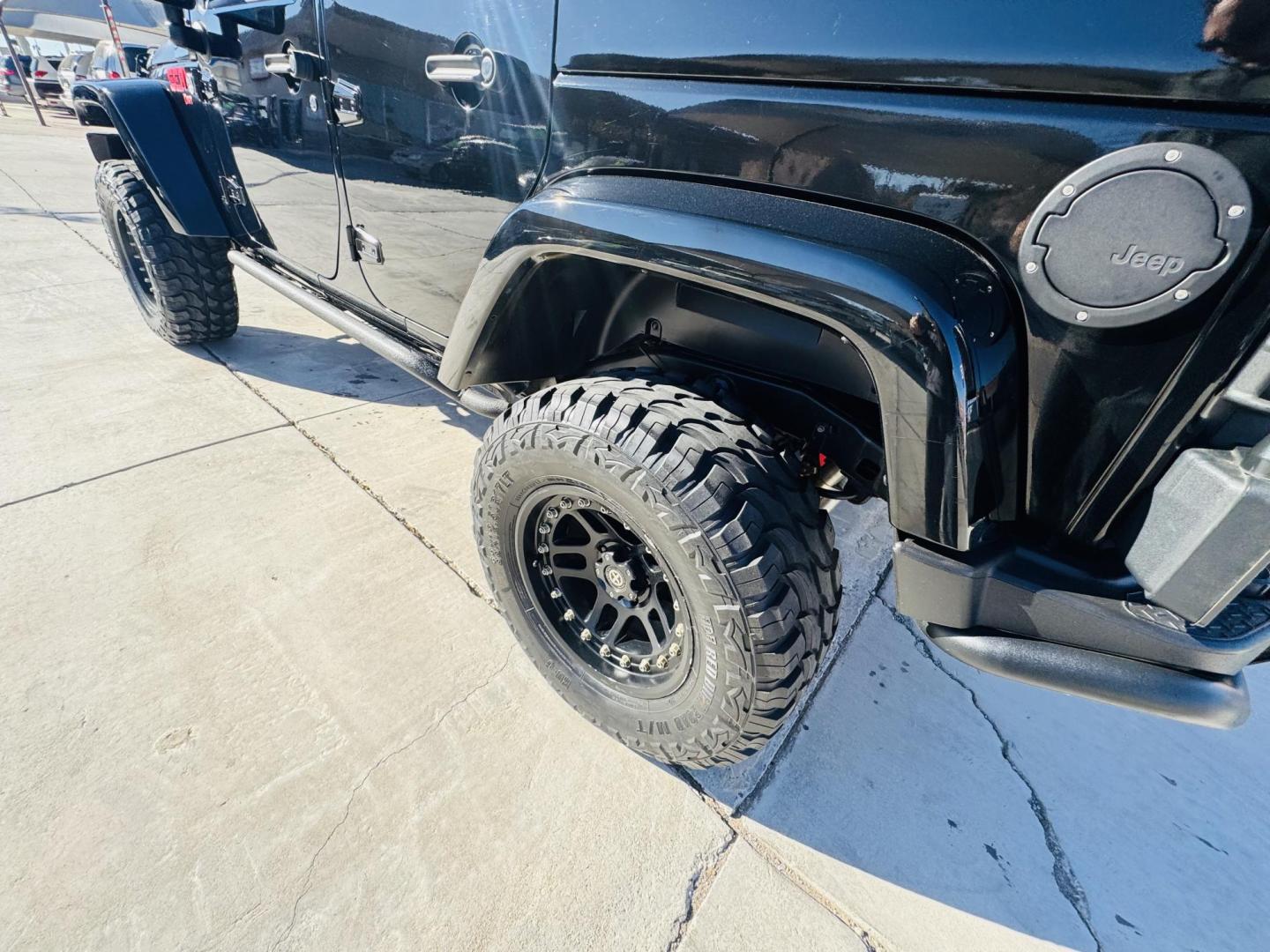 2014 Black Jeep Wrangler Unlimited Rubicon 4WD (1C4BJWFG0EL) with an 3.6L V6 DOHC 24V FFV engine, located at 2190 Hwy 95, Bullhead City, AZ, 86442, (928) 704-0060, 0.000000, 0.000000 - 2014 Jeep wrangler Rubicon. Automatic 4x4. hard top. carbon custom hood. 4 in lift kit with 33 in tires. Lots of extras, full size spare, on board compressor. satellite radio, leather, navigation. Top of the line for jeeps. v6. 110k miles. In excellent shape. free and clear title. Financing availabl - Photo#15