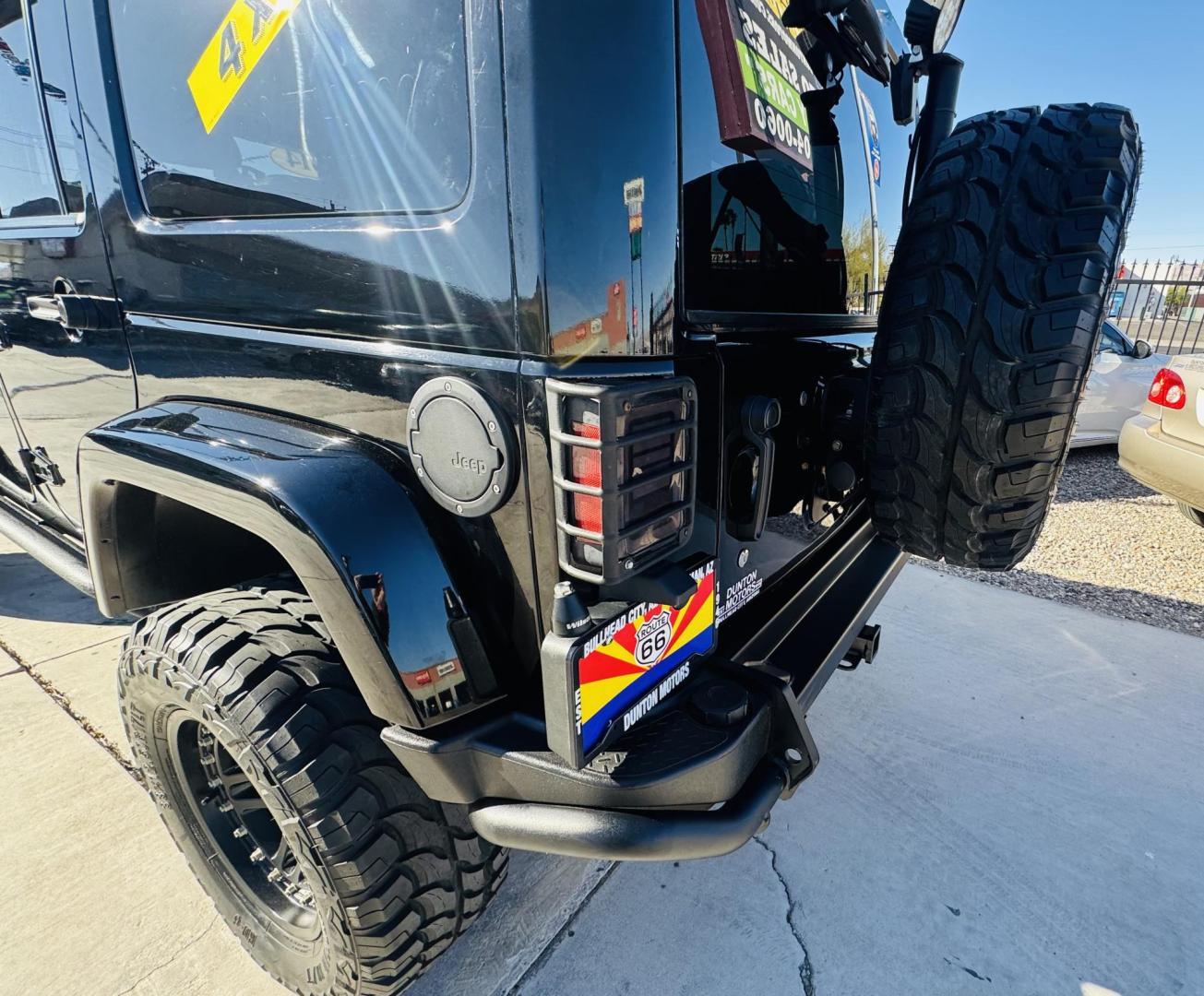 2014 Black Jeep Wrangler Unlimited Rubicon 4WD (1C4BJWFG0EL) with an 3.6L V6 DOHC 24V FFV engine, located at 2190 Hwy 95, Bullhead City, AZ, 86442, (928) 704-0060, 0.000000, 0.000000 - 2014 Jeep wrangler Rubicon. Automatic 4x4. hard top. carbon custom hood. 4 in lift kit with 33 in tires. Lots of extras, full size spare, on board compressor. satellite radio, leather, navigation. Top of the line for jeeps. v6. 110k miles. In excellent shape. free and clear title. Financing availabl - Photo#7