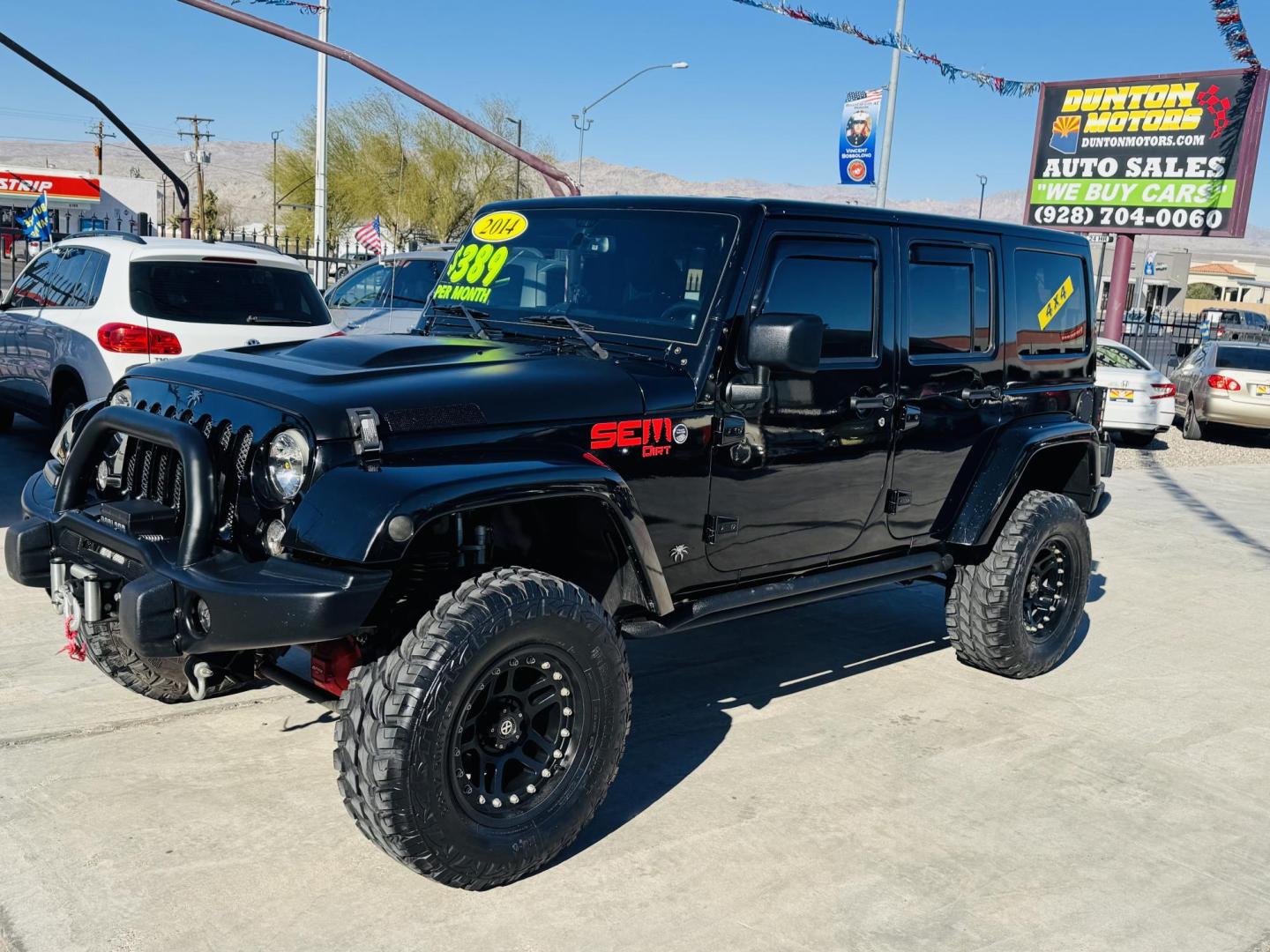 2014 Black Jeep Wrangler Unlimited Rubicon 4WD (1C4BJWFG0EL) with an 3.6L V6 DOHC 24V FFV engine, located at 2190 Hwy 95, Bullhead City, AZ, 86442, (928) 704-0060, 0.000000, 0.000000 - 2014 Jeep wrangler Rubicon. Automatic 4x4. hard top. carbon custom hood. 4 in lift kit with 33 in tires. Lots of extras, full size spare, on board compressor. satellite radio, leather, navigation. Top of the line for jeeps. v6. 110k miles. In excellent shape. free and clear title. Financing availabl - Photo#2