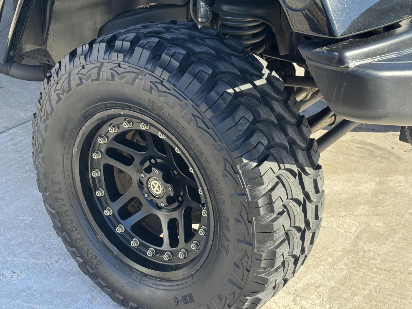 2014 Black Jeep Wrangler Unlimited Rubicon 4WD (1C4BJWFG0EL) with an 3.6L V6 DOHC 24V FFV engine, located at 2190 Hwy 95, Bullhead City, AZ, 86442, (928) 704-0060, 0.000000, 0.000000 - 2014 Jeep wrangler Rubicon. Automatic 4x4. hard top. carbon custom hood. 4 in lift kit with 33 in tires. Lots of extras, full size spare, on board compressor. satellite radio, leather, navigation. Top of the line for jeeps. v6. 110k miles. In excellent shape. free and clear title. Financing availabl - Photo#24