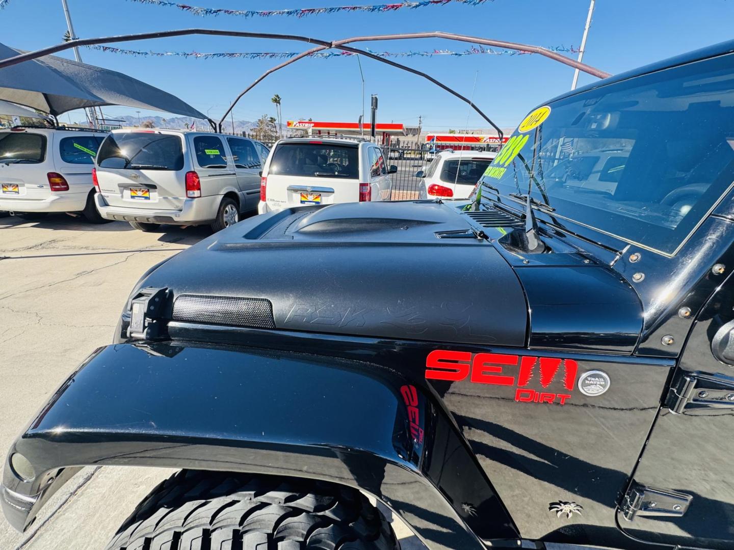 2014 Black Jeep Wrangler Unlimited Rubicon 4WD (1C4BJWFG0EL) with an 3.6L V6 DOHC 24V FFV engine, located at 2190 Hwy 95, Bullhead City, AZ, 86442, (928) 704-0060, 0.000000, 0.000000 - 2014 Jeep wrangler Rubicon. Automatic 4x4. hard top. carbon custom hood. 4 in lift kit with 33 in tires. Lots of extras, full size spare, on board compressor. satellite radio, leather, navigation. Top of the line for jeeps. v6. 110k miles. In excellent shape. free and clear title. Financing availabl - Photo#3
