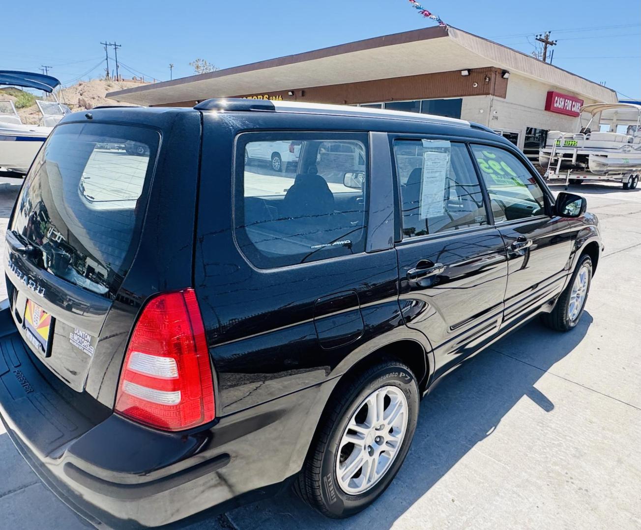 2005 Black Subaru Forester 2.5 XT (JF1SG69625H) with an 2.5L H4 DOHC 16V TURBO engine, 4-Speed Automatic Overdrive transmission, located at 2190 Hwy 95, Bullhead City, AZ, 86442, (928) 704-0060, 0.000000, 0.000000 - 2005 Subaru Forester lX. all wheel drive wagon . Has had replacement of transmission with a free warranty, free carfax. Runs and drives great. Brand new tires. Only at Dunton Motors. 142k miles. heated seats. super clean. In house financing. Buy Here Pay Here. We finance - Photo#3