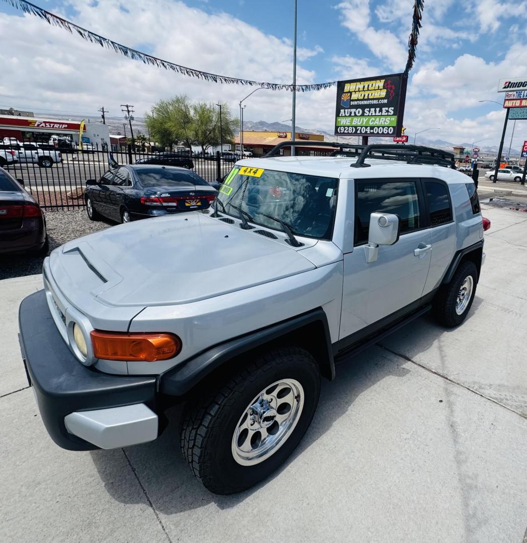 2007 Silver Toyota FJ Cruiser 4WD AT (JTEBU11F070) with an 3.4L V6 DOHC 24V engine, 5-Speed Automatic Overdrive transmission, located at 2190 Hwy 95, Bullhead City, AZ, 86442, (928) 704-0060, 0.000000, 0.000000 - On consignment. This *1 owner hard to find 2007 Toyota FJ CRuiser. in excellent condition. Professionally repainted. All service records. Custom tires/wheels. Has aftermarket rack. bumpers etc. No accidents. Non smoker. One of the best suvs ever for off roading. Free and clear Arizona title. Only at - Photo#0