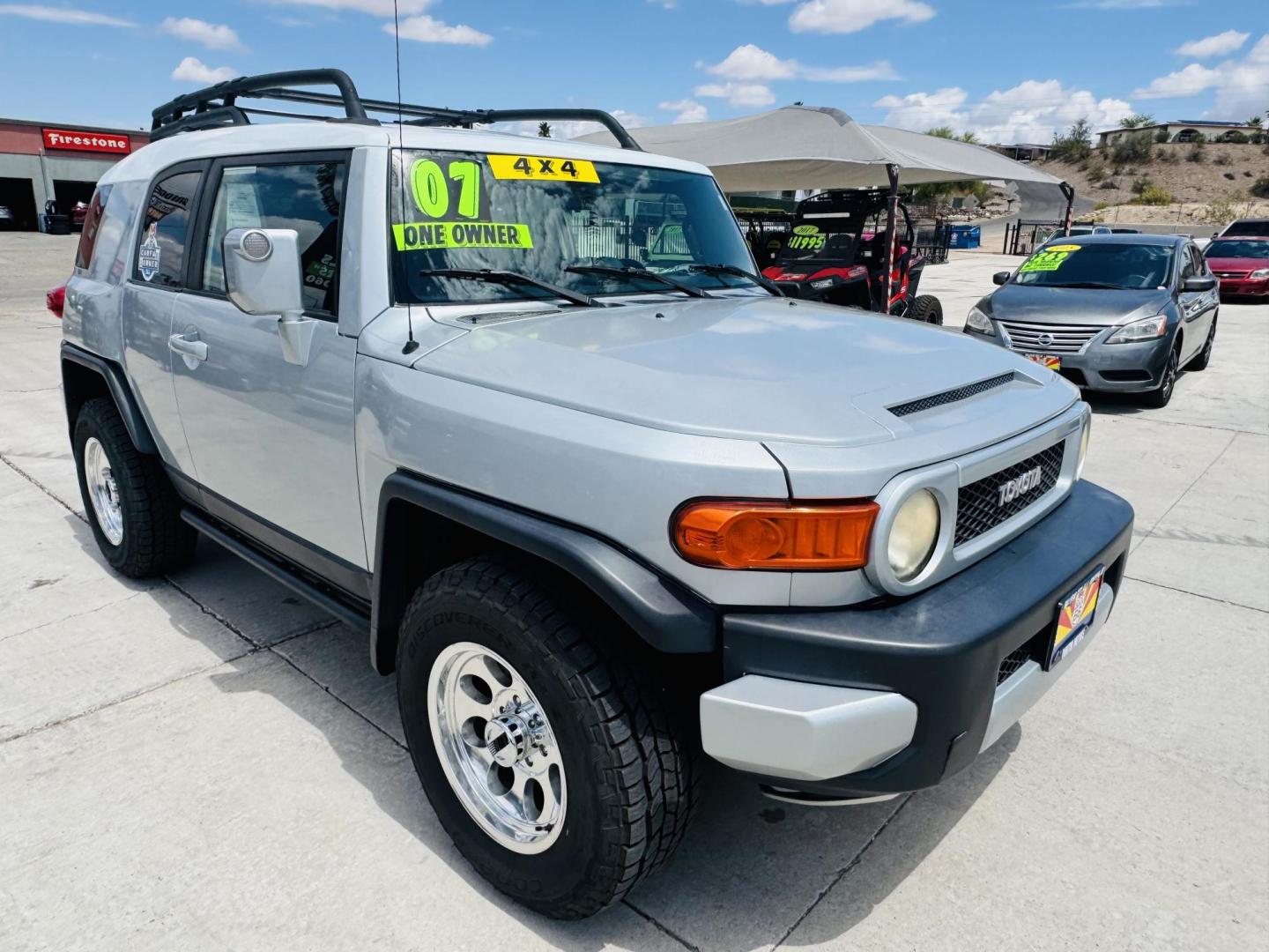 2007 Silver Toyota FJ Cruiser 4WD AT (JTEBU11F070) with an 3.4L V6 DOHC 24V engine, 5-Speed Automatic Overdrive transmission, located at 2190 Hwy 95, Bullhead City, AZ, 86442, (928) 704-0060, 0.000000, 0.000000 - On consignment. This *1 owner hard to find 2007 Toyota FJ CRuiser. in excellent condition. Professionally repainted. All service records. Custom tires/wheels. Has aftermarket rack. bumpers etc. No accidents. Non smoker. One of the best suvs ever for off roading. Free and clear Arizona title. Only at - Photo#1