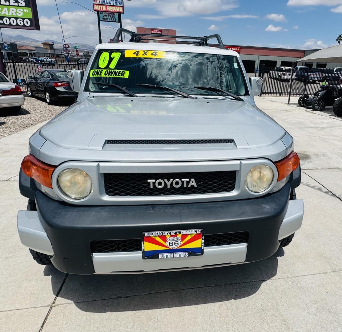 2007 Silver Toyota FJ Cruiser 4WD AT (JTEBU11F070) with an 3.4L V6 DOHC 24V engine, 5-Speed Automatic Overdrive transmission, located at 2190 Hwy 95, Bullhead City, AZ, 86442, (928) 704-0060, 0.000000, 0.000000 - On consignment. This *1 owner hard to find 2007 Toyota FJ CRuiser. in excellent condition. Professionally repainted. All service records. Custom tires/wheels. Has aftermarket rack. bumpers etc. No accidents. Non smoker. One of the best suvs ever for off roading. Free and clear Arizona title. Only at - Photo#2