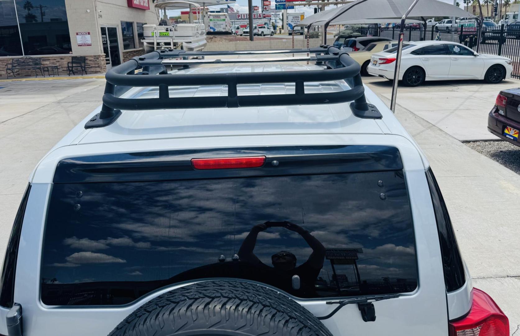 2007 Silver Toyota FJ Cruiser 4WD AT (JTEBU11F070) with an 3.4L V6 DOHC 24V engine, 5-Speed Automatic Overdrive transmission, located at 2190 Hwy 95, Bullhead City, AZ, 86442, (928) 704-0060, 0.000000, 0.000000 - On consignment. This *1 owner hard to find 2007 Toyota FJ CRuiser. in excellent condition. Professionally repainted. All service records. Custom tires/wheels. Has aftermarket rack. bumpers etc. No accidents. Non smoker. One of the best suvs ever for off roading. Free and clear Arizona title. Only at - Photo#5