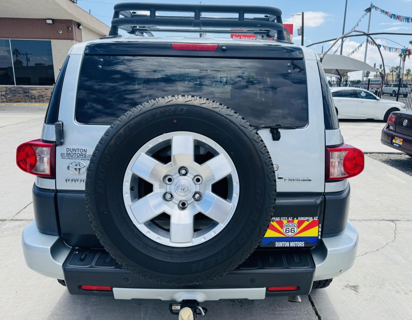 2007 Silver Toyota FJ Cruiser 4WD AT (JTEBU11F070) with an 3.4L V6 DOHC 24V engine, 5-Speed Automatic Overdrive transmission, located at 2190 Hwy 95, Bullhead City, AZ, 86442, (928) 704-0060, 0.000000, 0.000000 - On consignment. This *1 owner hard to find 2007 Toyota FJ CRuiser. in excellent condition. Professionally repainted. All service records. Custom tires/wheels. Has aftermarket rack. bumpers etc. No accidents. Non smoker. One of the best suvs ever for off roading. Free and clear Arizona title. Only at - Photo#4