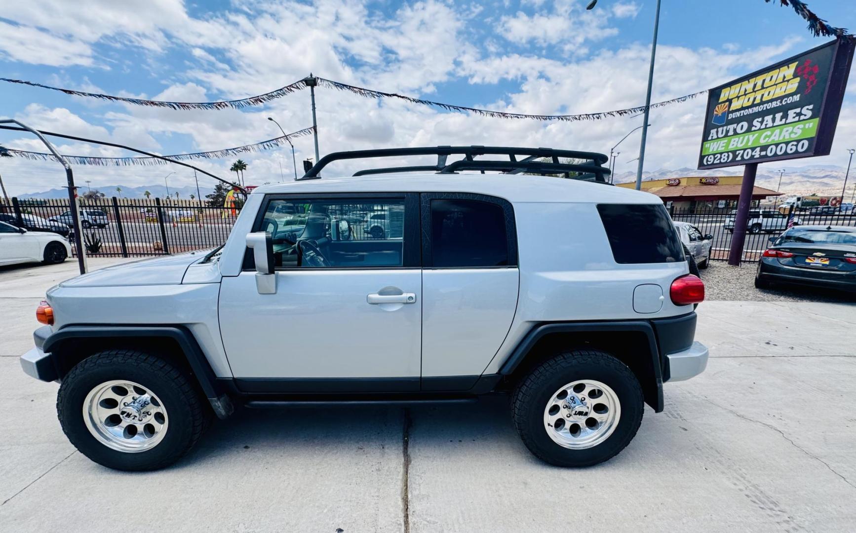 2007 Silver Toyota FJ Cruiser 4WD AT (JTEBU11F070) with an 3.4L V6 DOHC 24V engine, 5-Speed Automatic Overdrive transmission, located at 2190 Hwy 95, Bullhead City, AZ, 86442, (928) 704-0060, 0.000000, 0.000000 - On consignment. This *1 owner hard to find 2007 Toyota FJ CRuiser. in excellent condition. Professionally repainted. All service records. Custom tires/wheels. Has aftermarket rack. bumpers etc. No accidents. Non smoker. One of the best suvs ever for off roading. Free and clear Arizona title. Only at - Photo#10