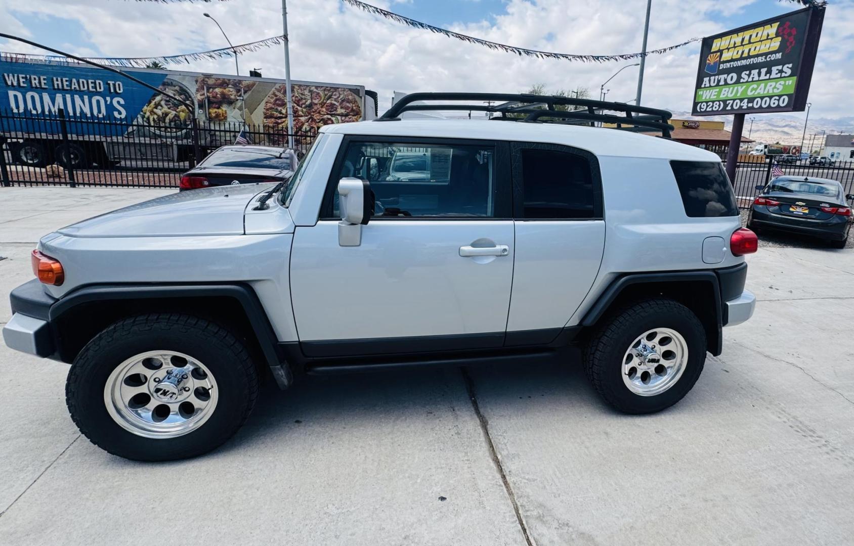 2007 Silver Toyota FJ Cruiser 4WD AT (JTEBU11F070) with an 3.4L V6 DOHC 24V engine, 5-Speed Automatic Overdrive transmission, located at 2190 Hwy 95, Bullhead City, AZ, 86442, (928) 704-0060, 0.000000, 0.000000 - On consignment. This *1 owner hard to find 2007 Toyota FJ CRuiser. in excellent condition. Professionally repainted. All service records. Custom tires/wheels. Has aftermarket rack. bumpers etc. No accidents. Non smoker. One of the best suvs ever for off roading. Free and clear Arizona title. Only at - Photo#12