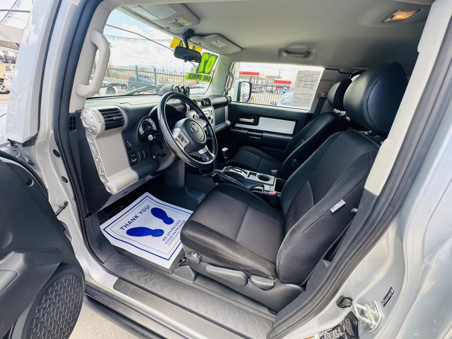 2007 Silver Toyota FJ Cruiser 4WD AT (JTEBU11F070) with an 3.4L V6 DOHC 24V engine, 5-Speed Automatic Overdrive transmission, located at 2190 Hwy 95, Bullhead City, AZ, 86442, (928) 704-0060, 0.000000, 0.000000 - On consignment. This *1 owner hard to find 2007 Toyota FJ CRuiser. in excellent condition. Professionally repainted. All service records. Custom tires/wheels. Has aftermarket rack. bumpers etc. No accidents. Non smoker. One of the best suvs ever for off roading. Free and clear Arizona title. Only at - Photo#17