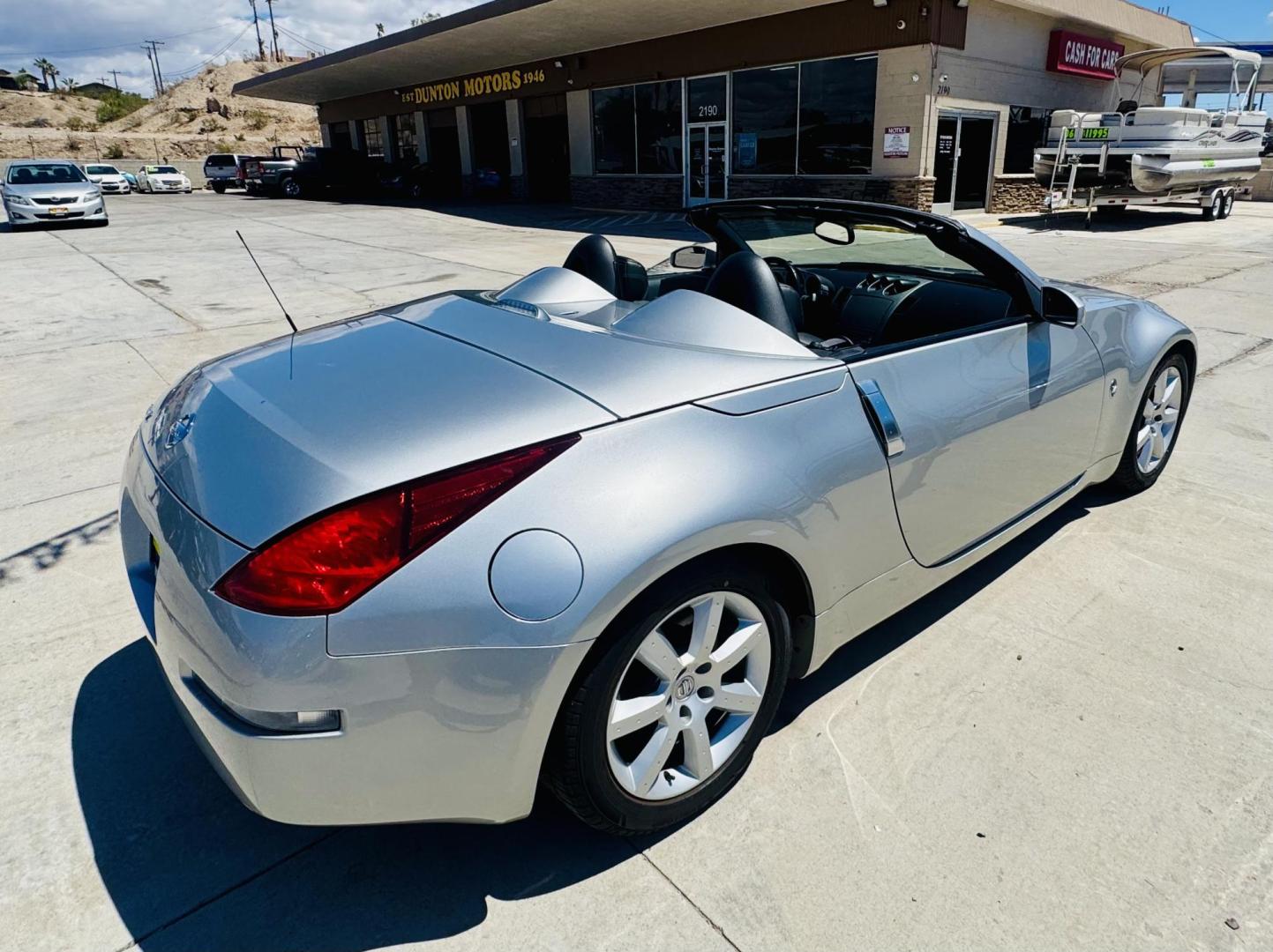 2004 Silver /black Nissan 350Z Enthusiast Roadster (JN1AZ36A74T) with an 3.5L V6 DOHC 24V engine, 6-Speed Manual Overdrive transmission, located at 2190 Hwy 95, Bullhead City, AZ, 86442, (928) 704-0060, 0.000000, 0.000000 - 2007 Nissan 350 Z convertible. Automatic . 2 owner clean carfax. Only !!!!! 25,425 original miles. Always garaged. in excellent condition. Automatic trans, electric power convertible top. tires 1 year old look like new. All maintenance records. What an amazing super clean low mileage fun car. Only - Photo#2