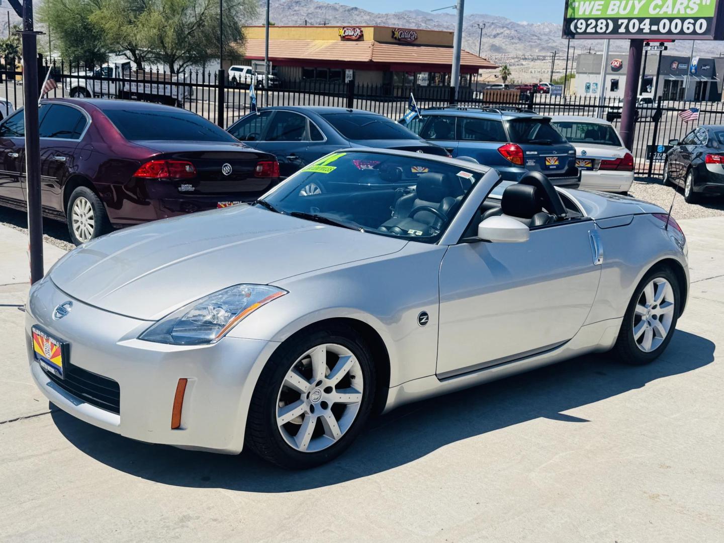 2004 Silver /black Nissan 350Z Enthusiast Roadster (JN1AZ36A74T) with an 3.5L V6 DOHC 24V engine, 6-Speed Manual Overdrive transmission, located at 2190 Hwy 95, Bullhead City, AZ, 86442, (928) 704-0060, 0.000000, 0.000000 - 2007 Nissan 350 Z convertible. Automatic . 2 owner clean carfax. Only !!!!! 25,425 original miles. Always garaged. in excellent condition. Automatic trans, electric power convertible top. tires 1 year old look like new. All maintenance records. What an amazing super clean low mileage fun car. Only - Photo#3