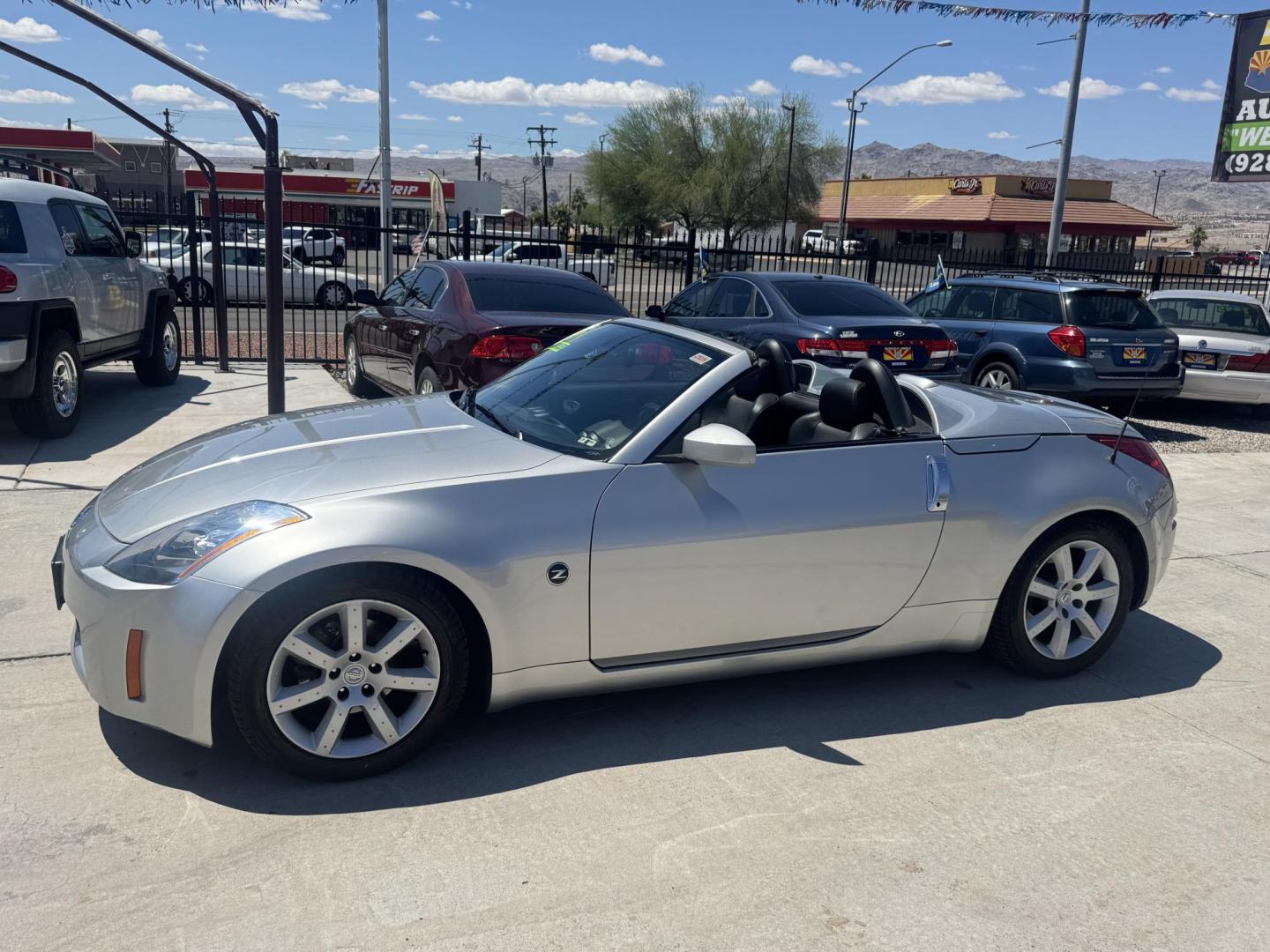 2004 Silver /black Nissan 350Z Enthusiast Roadster (JN1AZ36A74T) with an 3.5L V6 DOHC 24V engine, 6-Speed Manual Overdrive transmission, located at 2190 Hwy 95, Bullhead City, AZ, 86442, (928) 704-0060, 0.000000, 0.000000 - 2007 Nissan 350 Z convertible. Automatic . 2 owner clean carfax. Only !!!!! 25,425 original miles. Always garaged. in excellent condition. Automatic trans, electric power convertible top. tires 1 year old look like new. All maintenance records. What an amazing super clean low mileage fun car. Only - Photo#4