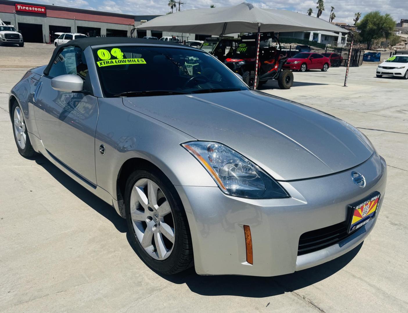 2004 Silver /black Nissan 350Z Enthusiast Roadster (JN1AZ36A74T) with an 3.5L V6 DOHC 24V engine, 6-Speed Manual Overdrive transmission, located at 2190 Hwy 95, Bullhead City, AZ, 86442, (928) 704-0060, 0.000000, 0.000000 - 2007 Nissan 350 Z convertible. Automatic . 2 owner clean carfax. Only !!!!! 25,425 original miles. Always garaged. in excellent condition. Automatic trans, electric power convertible top. tires 1 year old look like new. All maintenance records. What an amazing super clean low mileage fun car. Only - Photo#9